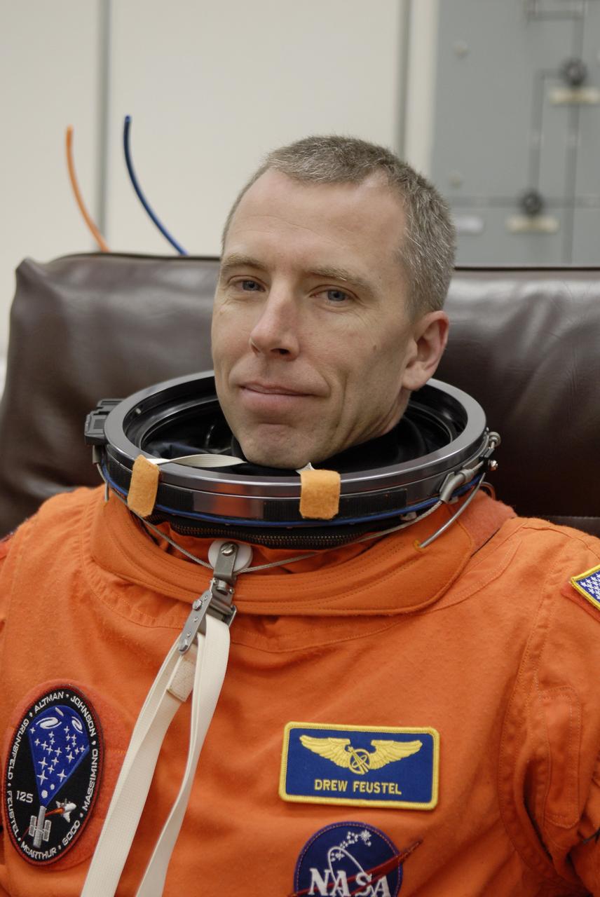 CAPE CANAVERAL, Fla. – STS-125 Mission Specialist Andrew Feustel puts on his launch-and-entry suit before heading for Launch Pad 39A at NASA's Kennedy Space Center in Florida. This launch will be Feustel's first space shuttle flight.  Liftoff is scheduled for 2:01 p.m. May 11 EDT.  Atlantis' 11-day flight will include five spacewalks to refurbish and upgrade NASA's Hubble Space Telescope with state-of-the-art science instruments that will expand Hubble's capabilities and extend its operational lifespan through at least 2014.  The payload includes a Wide Field Camera 3, fine guidance sensor and the Cosmic Origins Spectrograph. Photo credit: NASA/Kim Shiflett
