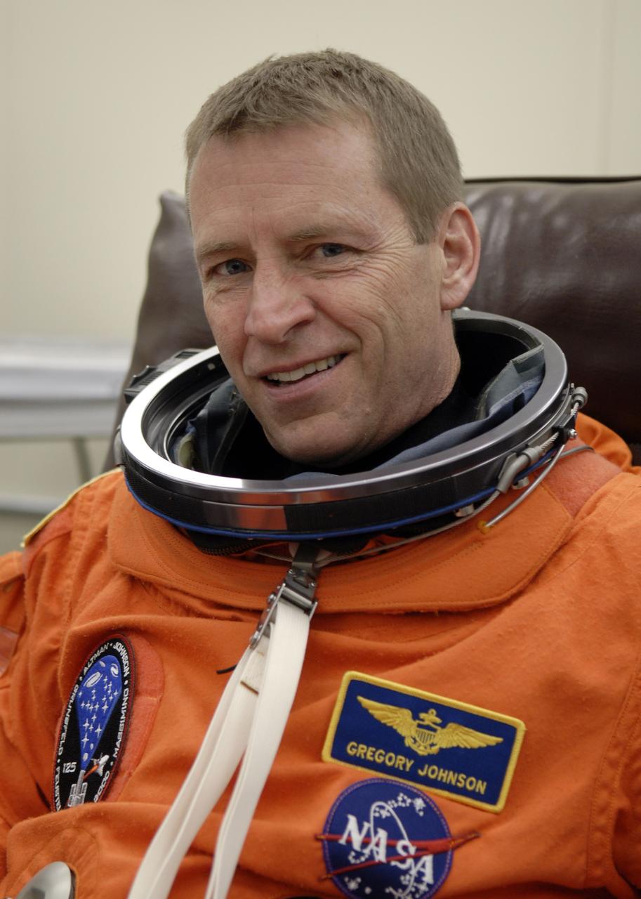 CAPE CANAVERAL, Fla. – STS-125 Pilot Gregory C. Johnson puts on his launch-and-entry suit before heading for Launch Pad 39A at NASA's Kennedy Space Center in Florida. This launch will be Johnson's first space shuttle flight.  Liftoff is scheduled for 2:01 p.m. May 11 EDT.  Atlantis' 11-day flight will include five spacewalks to refurbish and upgrade NASA's Hubble Space Telescope with state-of-the-art science instruments that will expand Hubble's capabilities and extend its operational lifespan through at least 2014.  The payload includes a Wide Field Camera 3, fine guidance sensor and the Cosmic Origins Spectrograph. Photo credit: NASA/Kim Shiflett