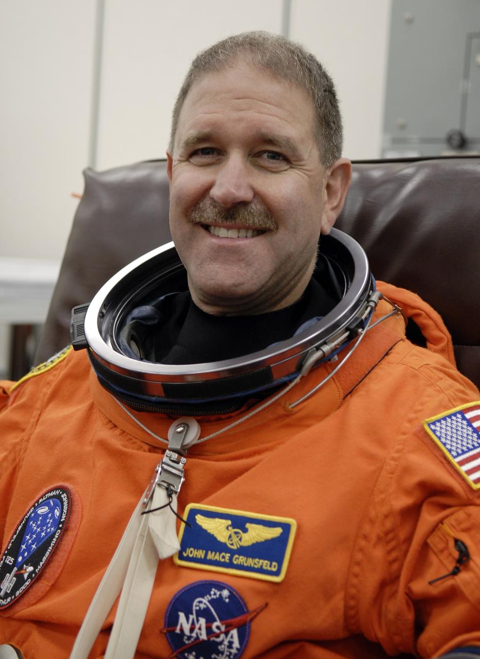 CAPE CANAVERAL, Fla. – STS-125 Mission Specialist John Grunsfeld puts on his launch-and-entry suit before heading for Launch Pad 39A at NASA's Kennedy Space Center in Florida. This launch will be Grunsfeld's fifth space shuttle flight.  Liftoff is scheduled for 2:01 p.m. May 11 EDT.  Atlantis' 11-day flight will include five spacewalks to refurbish and upgrade NASA's Hubble Space Telescope with state-of-the-art science instruments that will expand Hubble's capabilities and extend its operational lifespan through at least 2014.  The payload includes a Wide Field Camera 3, fine guidance sensor and the Cosmic Origins Spectrograph. Photo credit: NASA/Kim Shiflett