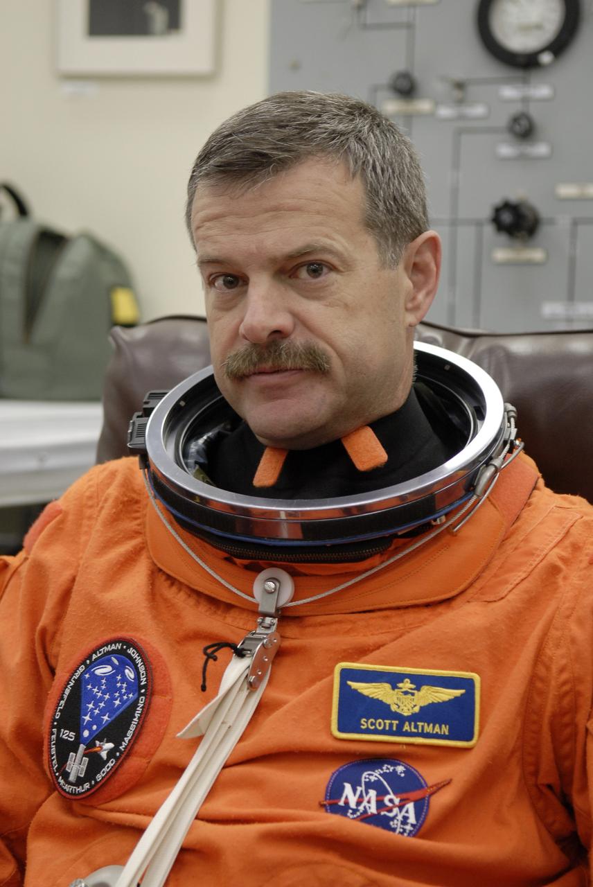 CAPE CANAVERAL, Fla. – STS-125 Commander Scott Altman puts on his launch-and-entry suit before heading for Launch Pad 39A at NASA's Kennedy Space Center in Florida. This launch will be Altman's fourth space shuttle flight.  Liftoff is scheduled for 2:01 p.m. May 11 EDT. Atlantis' 11-day flight will include five spacewalks to refurbish and upgrade NASA's Hubble Space Telescope with state-of-the-art science instruments that will expand Hubble's capabilities and extend its operational lifespan through at least 2014.  The payload includes a Wide Field Camera 3, fine guidance sensor and the Cosmic Origins Spectrograph. Photo credit: NASA/Kim Shiflett