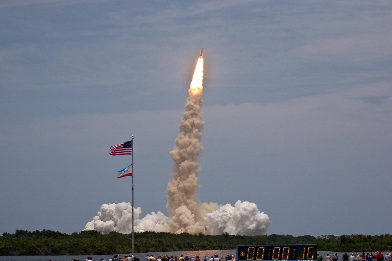 CAPE CANAVERAL, Fla. – Under a dry, hot, cloud-washed Florida sky, space shuttle Atlantis roars off Launch Pad 39A at NASA's Kennedy Space Center in Florida with its crew of seven for a rendezvous with NASA's Hubble Space Telescope.  The launch was on-time at 2:01 p.m. EDT.  Atlantis' 11-day flight will include five spacewalks to refurbish and upgrade the telescope with state-of-the-art science instruments that will expand Hubble's capabilities and extend its operational lifespan through at least 2014.  The payload includes a Wide Field Camera 3, fine guidance sensor and the Cosmic Origins Spectrograph.  Photo credit: NASA/Fletcher Hildreth