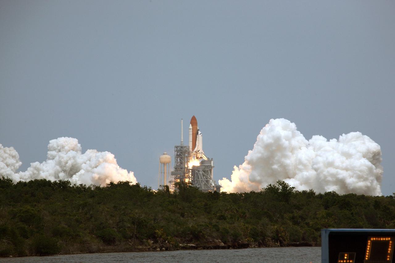 CAPE CANAVERAL, Fla. – White clouds of smoke and steam sandwich space shuttle Atlantis as it roars off Launch Pad 39A at NASA's Kennedy Space Center in Florida with its crew of seven for a rendezvous with NASA's Hubble Space Telescope.  The launch was on-time at 2:01 p.m. EDT. Atlantis' 11-day flight will include five spacewalks to refurbish and upgrade the telescope with state-of-the-art science instruments that will expand Hubble's capabilities and extend its operational lifespan through at least 2014.  The payload includes a Wide Field Camera 3, fine guidance sensor and the Cosmic Origins Spectrograph.  Photo credit: NASA/Fletcher Hildreth