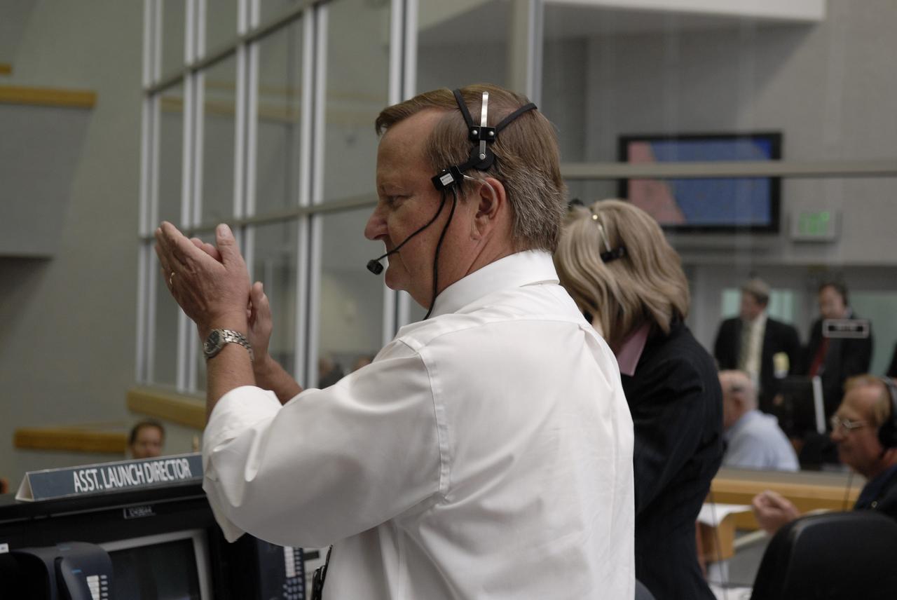 CAPE CANAVERAL, Fla. – In the Firing Room at NASA's Kennedy Space Center in Florida, Shuttle Launch Director Mike Leinbach congratulates the mission management team for the successful launch of space shuttle Atlantis. Liftoff was on time at 2:01 p.m. EDT. Atlantis' 11-day flight will include five spacewalks to refurbish and upgrade the telescope with state-of-the-art science instruments that will expand Hubble's capabilities and extend its operational lifespan through at least 2014.  The payload includes a Wide Field Camera 3, fine guidance sensor and the Cosmic Origins Spectrograph.  Photo credit: NASA/Kim Shiflett
