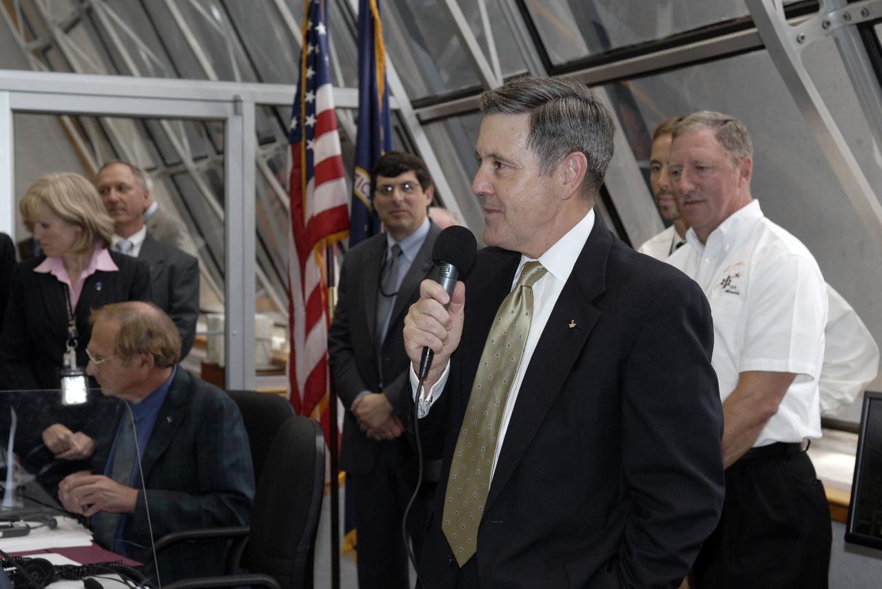 CAPE CANAVERAL, Fla. – In the Firing Room at NASA's Kennedy Space Center in Florida,  Center Director Bob Cabana congratulates the mission management team for the successful launch of space shuttle Atlantis. Liftoff was on time at 2:01 p.m. EDT. Atlantis' 11-day flight will include five spacewalks to refurbish and upgrade the telescope with state-of-the-art science instruments that will expand Hubble's capabilities and extend its operational lifespan through at least 2014.  The payload includes a Wide Field Camera 3, fine guidance sensor and the Cosmic Origins Spectrograph.  Photo credit: NASA/Kim Shiflett