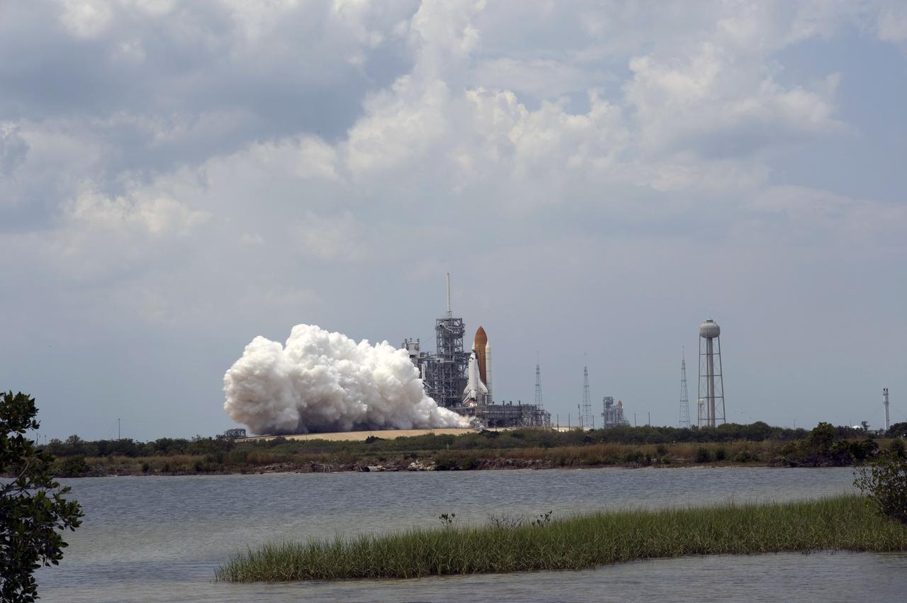 CAPE CANAVERAL, Fla. – Clouds of smoke and steam begin rolling across Launch Pad 39A at NASA's Kennedy Space Center in Florida at liftoff of space shuttle Atlantis on the STS-125 mission.  Atlantis and its crew of seven will rendezvous with NASA's Hubble Space Telescope.  The launch was on-time at 2:01 p.m. EDT. Atlantis' 11-day flight will include five spacewalks to refurbish and upgrade the telescope with state-of-the-art science instruments that will expand Hubble's capabilities and extend its operational lifespan through at least 2014.  The payload includes a Wide Field Camera 3, fine guidance sensor and the Cosmic Origins Spectrograph.  Photo credit: NASA/Sandra Joseph-Kevin O'Connell