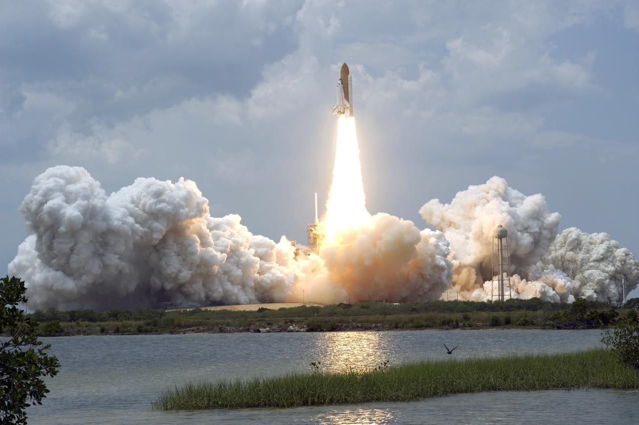 CAPE CANAVERAL, Fla. – Riding a column of fire, space shuttle Atlantis roars away from Launch Pad 39A at NASA's Kennedy Space Center in Florida toward its rendezvous with NASA's Hubble Space Telescope.  The liftoff was on-time at 2:01 p.m. EDT.  Atlantis' 11-day flight will include five spacewalks to refurbish and upgrade the telescope with state-of-the-art science instruments that will expand Hubble's capabilities and extend its operational lifespan through at least 2014.  The payload includes a Wide Field Camera 3, fine guidance sensor and the Cosmic Origins Spectrograph.  Photo credit: NASA/Sandra Joseph-Kevin O'Connell