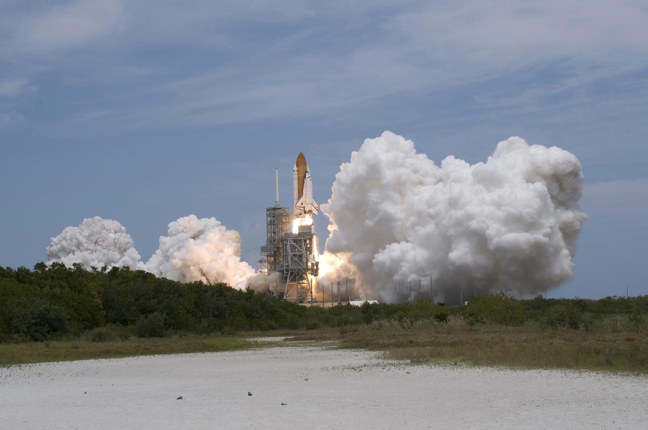 CAPE CANAVERAL, Fla. – Clouds of smoke and steam swell over Launch Pad 39A at NASA's Kennedy Space Center in Florida as space shuttle Atlantis hurtles toward space on the STS-125 mission.  Atlantis will rendezvous with NASA's Hubble Space Telescope. Liftoff was on time at 2:01 p.m. EDT.  Atlantis' 11-day flight will include five spacewalks to refurbish and upgrade the telescope with state-of-the-art science instruments that will expand Hubble's capabilities and extend its operational lifespan through at least 2014.  The payload includes a Wide Field Camera 3, fine guidance sensor and the Cosmic Origins Spectrograph.  Photo credit: NASA/Tony Gray-Tom Farrar