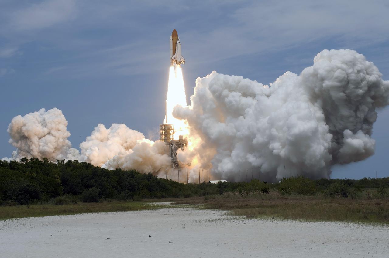 CAPE CANAVERAL, Fla. – As clouds of smoke and steam smother Launch Pad 39A at NASA's Kennedy Space Center in Florida, space shuttle Atlantis soars above them atop a column of fire.  Atlantis will rendezvous with NASA's Hubble Space Telescope on the STS-125 mission.  Liftoff was on time at 2:01 p.m. EDT.  Atlantis' 11-day flight will include five spacewalks to refurbish and upgrade the telescope with state-of-the-art science instruments that will expand Hubble's capabilities and extend its operational lifespan through at least 2014.  The payload includes a Wide Field Camera 3, fine guidance sensor and the Cosmic Origins Spectrograph.  Photo credit: NASA/Tony Gray-Tom Farrar