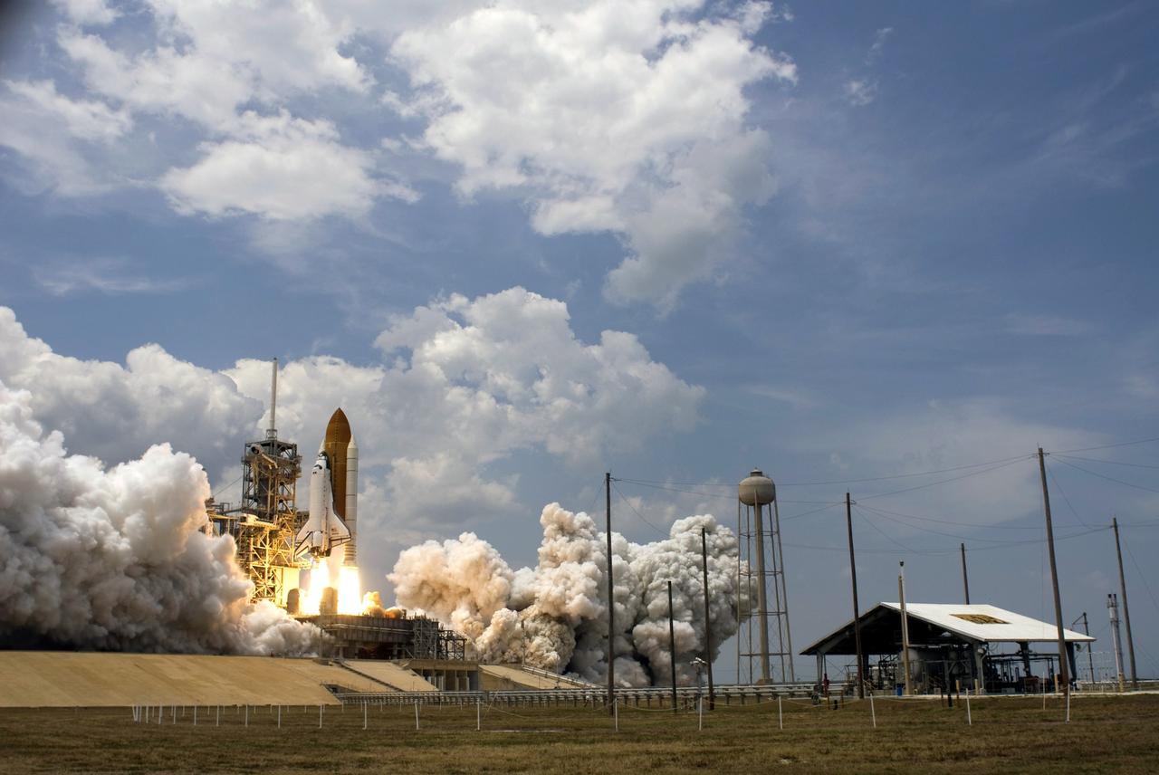 CAPE CANAVERAL, Fla. – Clouds of smoke and steam fill Launch Pad 39A at NASA's Kennedy Space Center in Florida as space shuttle Atlantis soars into clouds above atop twin columns of fire.  Atlantis will rendezvous with NASA's Hubble Space Telescope on the STS-125 mission.  Liftoff was on time at 2:01 p.m. EDT.  Atlantis' 11-day flight will include five spacewalks to refurbish and upgrade the telescope with state-of-the-art science instruments that will expand Hubble's capabilities and extend its operational lifespan through at least 2014.  The payload includes a Wide Field Camera 3, fine guidance sensor and the Cosmic Origins Spectrograph.  Photo credit: NASA/Sandra Joseph-Kevin O'Connell