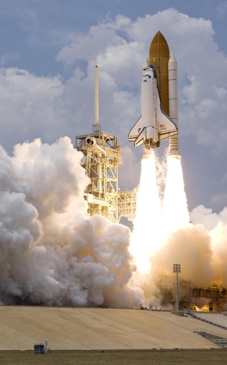 CAPE CANAVERAL, Fla. – On twin towers of flame, space shuttle Atlantis roars into space from Launch Pad 39A at NASA's Kennedy Space Center in Florida  on the STS-125 mission to service NASA's Hubble Space Telescope.  Liftoff was on time at 2:01 p.m. EDT.   Atlantis' 11-day flight will include five spacewalks to refurbish and upgrade the telescope with state-of-the-art science instruments that will expand Hubble's capabilities and extend its operational lifespan through at least 2014.  The payload includes a Wide Field Camera 3, Fine Guidance Sensor and the Cosmic Origins Spectrograph.   Photo courtesy of Scott Andrews