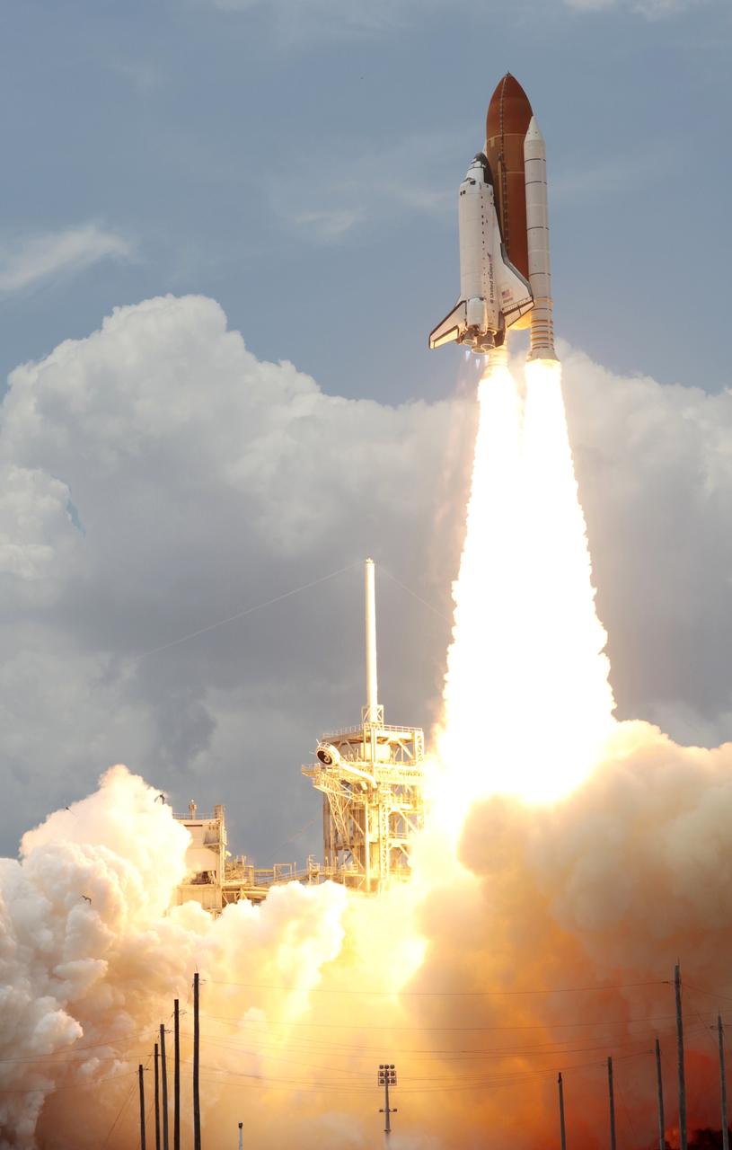 CAPE CANAVERAL, Fla. – From Launch Pad 39A at NASA's Kennedy Space Center in Florida, space shuttle Atlantis hurtles past the lightning mast into space on twin columns of fire on the STS-125 mission to service NASA's Hubble Space Telescope.  Liftoff was on time at 2:01 p.m. EDT. Atlantis' 11-day flight will include five spacewalks to refurbish and upgrade the telescope with state-of-the-art science instruments that will expand Hubble's capabilities and extend its operational lifespan through at least 2014.  The payload includes a Wide Field Camera 3, Fine Guidance Sensor and the Cosmic Origins Spectrograph.   Photo courtesy of Scott Andrews