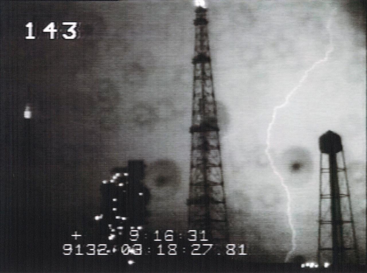 CAPE CANAVERAL, Fla. – This photo shows one of two lightning strikes that occurred on May 11 around 11 p.m. within a third of a mile of space shuttle Endeavour on Launch Pad 39B at NASA's Kennedy Space Center in Florida. Engineers and safety personnel evaluated data and performed a walkdown of the pad and determined there is no damage to the vehicle or the pad. The images are from Kennedy's Operational Television cameras which can be used to triangulate the location of lightning strikes. Other detection systems include the Cloud-To-Ground Lightning Surveillance System, Strikenet/National Lightning Detection Network, Lightning Induced Voltage Instrumentation System and the Catenary Wire Lightning Instrumentation System.  Endeavour is standing by on the pad, prepared for liftoff in the unlikely event that a rescue mission is necessary during space shuttle Atlantis' STS-125 mission to service NASA's Hubble Space Telescope.  Photo credit: NASA