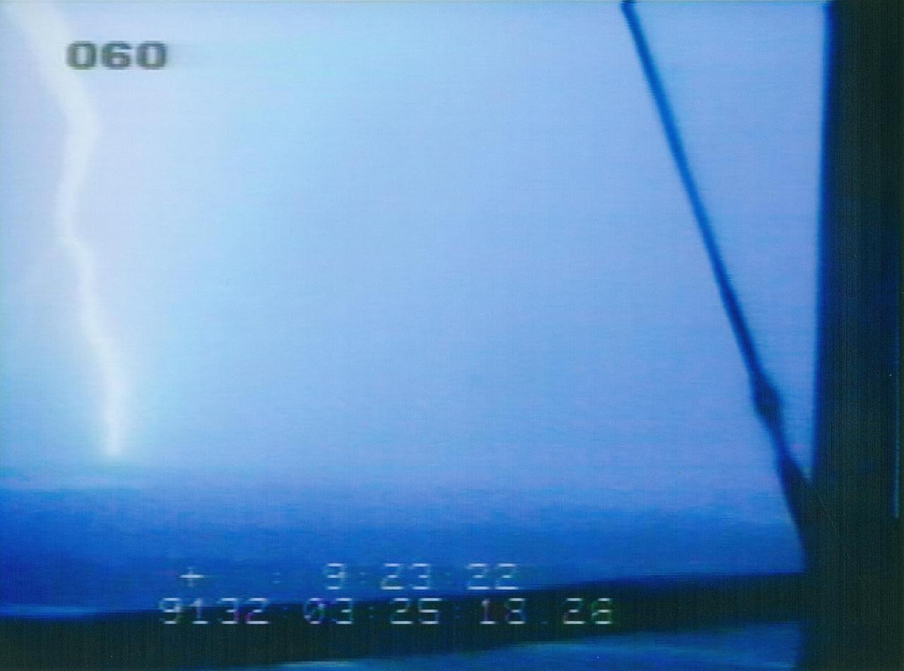 CAPE CANAVERAL, Fla. – This photo taken from Launch Pad 39A  at NASA's Kennedy Space Center in Florida shows one of two lightning strikes that occurred on May 11 around 11 p.m. within a third of a mile of space shuttle Endeavour on Launch Pad 39B. Engineers and safety personnel evaluated data and performed a walkdown of the pad and determined there is no damage to the vehicle or the pad. The images are from Kennedy's Operational Television cameras which can be used to triangulate the location of lightning strikes. Other detection systems include the Cloud-To-Ground Lightning Surveillance System, Strikenet/National Lightning Detection Network, Lightning Induced Voltage Instrumentation System and the Catenary Wire Lightning Instrumentation System.  Endeavour is standing by on the pad, prepared for liftoff in the unlikely event that a rescue mission is necessary during space shuttle Atlantis' STS-125 mission to service NASA's Hubble Space Telescope.  Photo credit: NASA
