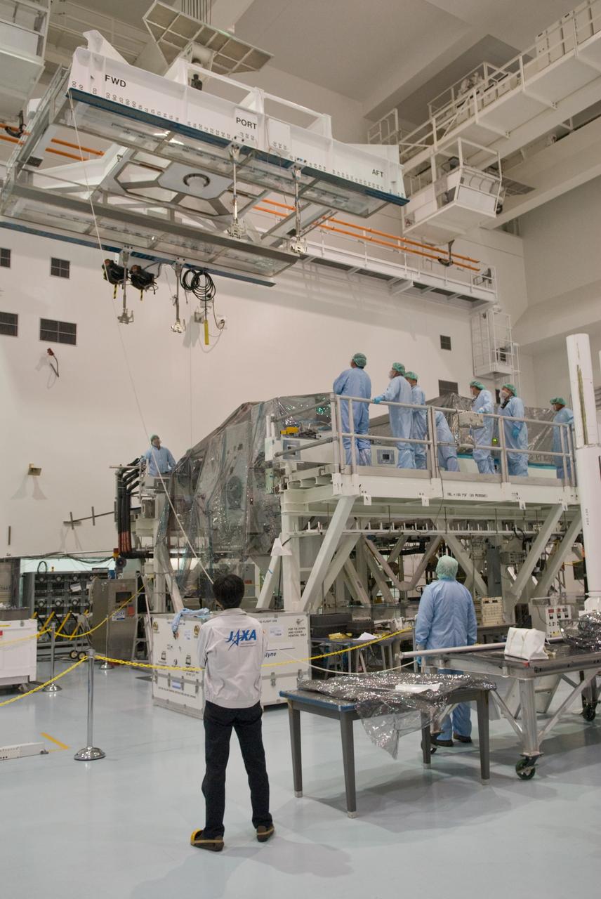 CAPE CANAVERAL, Fla. – In the Space Station Processing Facility at NASA's Kennedy Space Center in Florida, an overhead crane is moved toward the Kibo Experiment Logistics Module Exposed Section, or ELM-ES.  The crane will transfer the ES to the payload canister that will transport it to Launch Pad 39A. The ELM-ES is one of the final components of the Japan Aerospace Exploration Agency's Kibo laboratory for the International Space Station. It can provide payload storage space and can carry up to three payloads at launch. The canister will deliver the ELM-ES and other elements to Launch Pad 39A for installation in space shuttle Endeavour's payload bay. The STS-127 mission is targeted for launch June 13.  Photo credit: NASA/Jack Pfaller