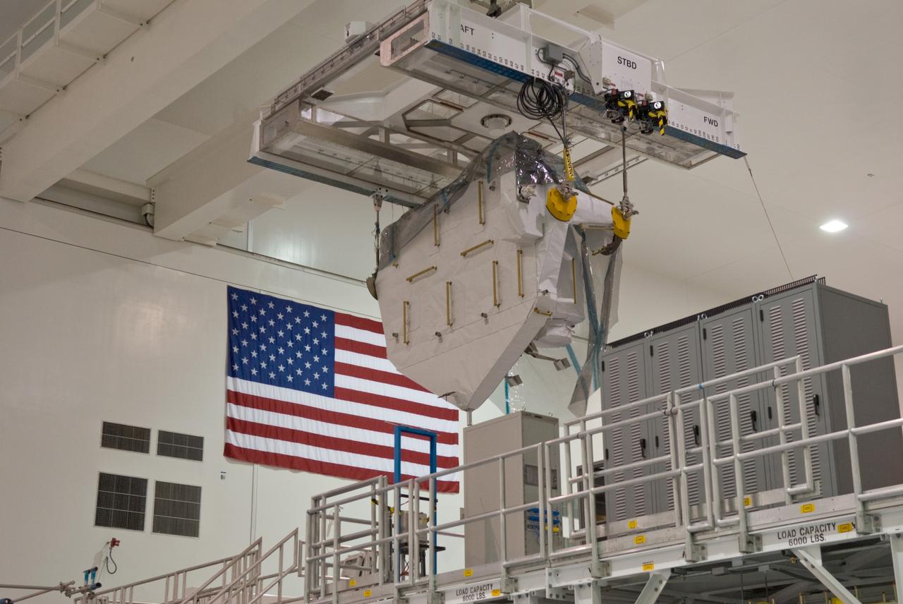 CAPE CANAVERAL, Fla. – Kibo Experiment Logistics Module Exposed Section, or ELM-ES, from its work stand to a payload canister. The canister will transport the payload to Launch Pad 39A. The ELM-ES is one of the final components of the Japan Aerospace Exploration Agency's Kibo laboratory for the International Space Station. It can provide payload storage space and can carry up to three payloads at launch. The canister will deliver the ELM-ES and other elements to Launch Pad 39A for installation in space shuttle Endeavour's payload bay. The STS-127 mission is targeted for launch June 13. Photo credit: NASA/Jack Pfaller