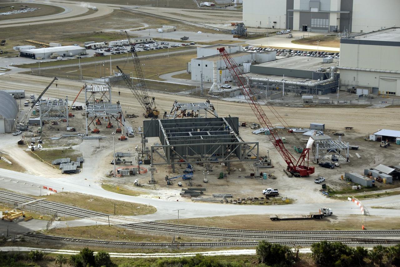 CAPE CANAVERAL, Fla. – In the mobile launcher parking area behind the Vehicle Assembly Building at NASA's Kennedy Space Center in Florida, the new mobile launcher, or ML, for the Ares rockets is under construction.  The ML will be the base to launch the Orion crew exploration vehicle and the cargo vehicle.  The base is being made lighter than space shuttle mobile launcher platforms so the crawler-transporter can pick up the added load of the 345-foot tower and taller rocket. When the structural portion of the new mobile launcher is complete, umbilicals, access arms, communications equipment and command/control equipment will be installed. Photo credit: NASA/Kim Shiflett