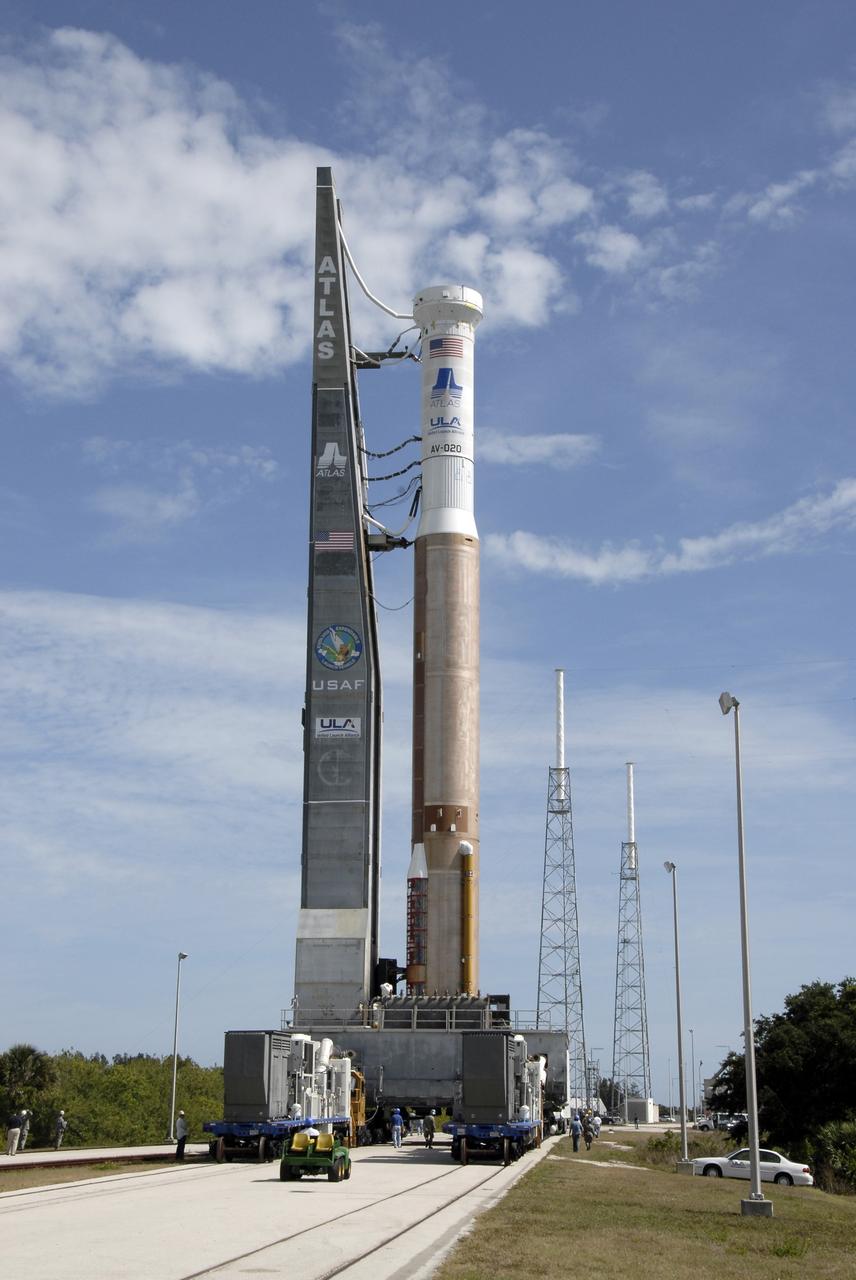CAPE CANAVERAL, Fla. – The Atlas V/Centaur is moving from the Vertical Integration Facility at Cape Canaveral Air Force Station in Florida to Launch Complex-41.  At right are two of the four lightning towers that surround the pad for protection against possible lightning strikes. The Atlas was rolled to the launch pad from the Vertical Integration Facility in preparation for the wet dress rehearsal, or countdown test, which means being fully loaded with propellants including liquid hydrogen, liquid oxygen and RP-1 fuel. The launch vehicle will be rolled off the pad and returned to the VIF on May 16. The Atlas V/Centaur is the launch vehicle for NASA's Lunar Reconnaissance Orbiter, or LRO, and NASA's Lunar CRater Observation and Sensing Satellite, known as LCROSS. They will be mated with the Atlas in late May. LCROSS and LRO are the first missions in NASA's plan to return humans to the moon and begin establishing a lunar outpost by 2020. Launch is scheduled for no earlier than June 17.  Photo credit: NASA/Kim Shiflett