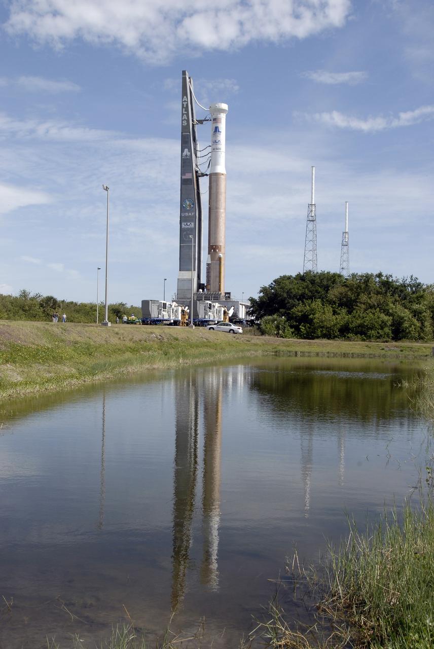 CAPE CANAVERAL, Fla. – The Atlas V/Centaur nears Launch Complex-41 at Cape Canaveral Air Force Station in Florida. At right in the background are two of the four lightning towers that surround the pad for protection against possible lightning strikes.  The Atlas was rolled to the launch pad from the Vertical Integration Facility in preparation for the wet dress rehearsal, or countdown test, which means being fully loaded with propellants including liquid hydrogen, liquid oxygen and RP-1 fuel. The launch vehicle will be rolled off the pad and returned to the VIF on May 16. The Atlas V/Centaur is the launch vehicle for NASA's Lunar Reconnaissance Orbiter, or LRO, and NASA's Lunar CRater Observation and Sensing Satellite, known as LCROSS. They will be mated with the Atlas in late May. LCROSS and LRO are the first missions in NASA's plan to return humans to the moon and begin establishing a lunar outpost by 2020. Launch is scheduled for no earlier than June 17.  Photo credit: NASA/Kim Shiflett