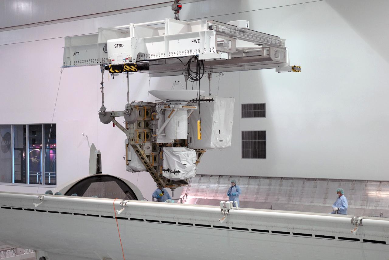 CAPE CANAVERAL, Fla. – – In the Space Station Processing Facility at NASA's Kennedy Space Center in Florida, an overhead crane lowers the Integrated Cargo Carrier-VLD (Vertical Light Deployment), part of the payload for the STS-127 mission, toward the payload canister. The canister will deliver the ICC-VLD and other elements to Launch Pad 39A for installation in space shuttle Endeavour's payload bay. Launch is targeted for June 13. Photo credit: NASA/Troy Cryder