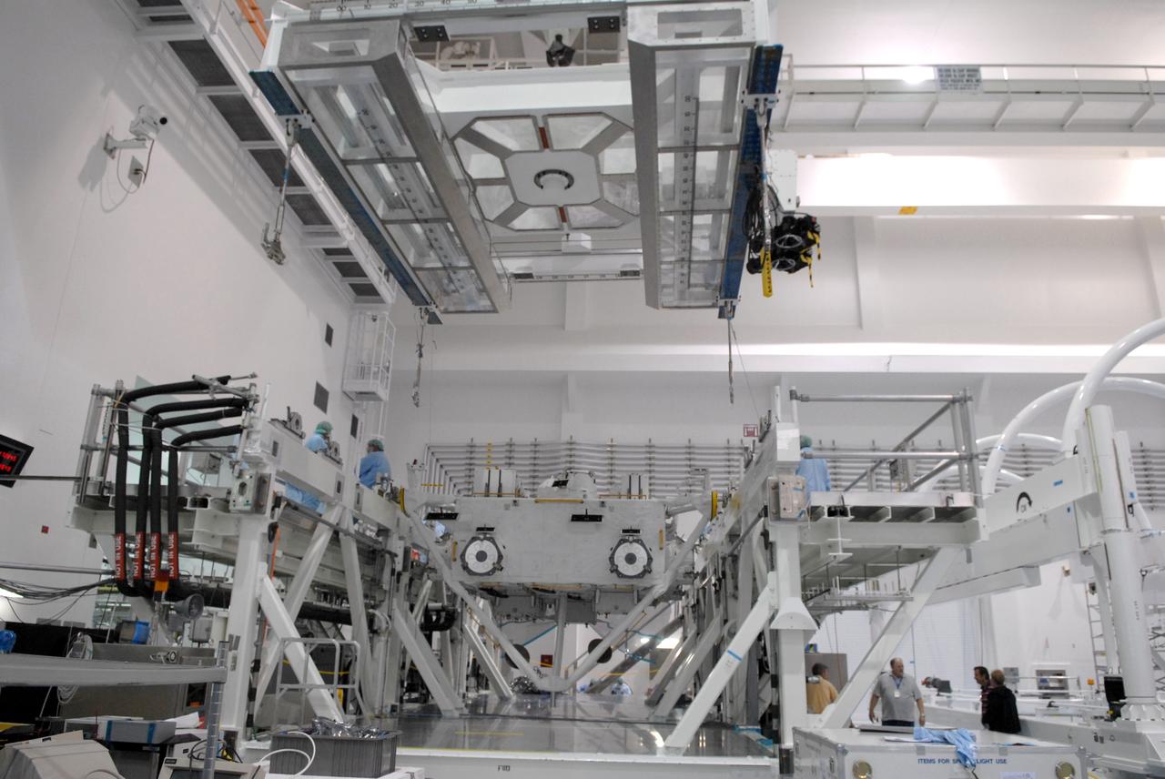 CAPE CANAVERAL, Fla. – In the Space Station Processing Facility at NASA's Kennedy Space Center in Florida, an overhead crane is moved into position above the Japan Aerospace Exploration Agency's Kibo Exposed Facility, or EF, part of the payload for the STS-127 mission. The module will be transferred to the payload canister. The EF, along with the Experiment Logistics Module Exposed Section, will be carried aboard space shuttle Endeavour on the STS-127 mission targeted for launch June 13. When the EF is installed on the Kibo laboratory, it will provide a multipurpose platform where science experiments can be deployed and operated in the exposed environment. The payloads attached to the EF can be exchanged or retrieved by Kibo's robotic arm, the JEM Remote Manipulator. Photo credit: NASA/Jack Pfaller