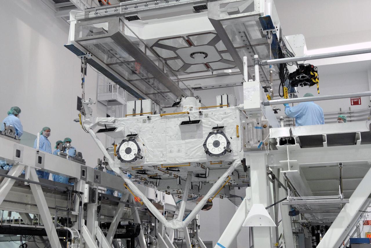 CAPE CANAVERAL, Fla. – In the Space Station Processing Facility at NASA's Kennedy Space Center in Florida, an overhead crane is attached to the Japan Aerospace Exploration Agency's Kibo Exposed Facility, or EF, part of the payload for the STS-127 mission.  The module will be transferred to the payload canister.  The EF, along with the Experiment Logistics Module Exposed Section, will be carried aboard space shuttle Endeavour on the STS-127 mission targeted for launch June 13. When the EF is installed on the Kibo laboratory, it will provide a multipurpose platform where science experiments can be deployed and operated in the exposed environment. The payloads attached to the EF can be exchanged or retrieved by Kibo's robotic arm, the JEM Remote Manipulator.  Photo credit: NASA/Jack Pfaller