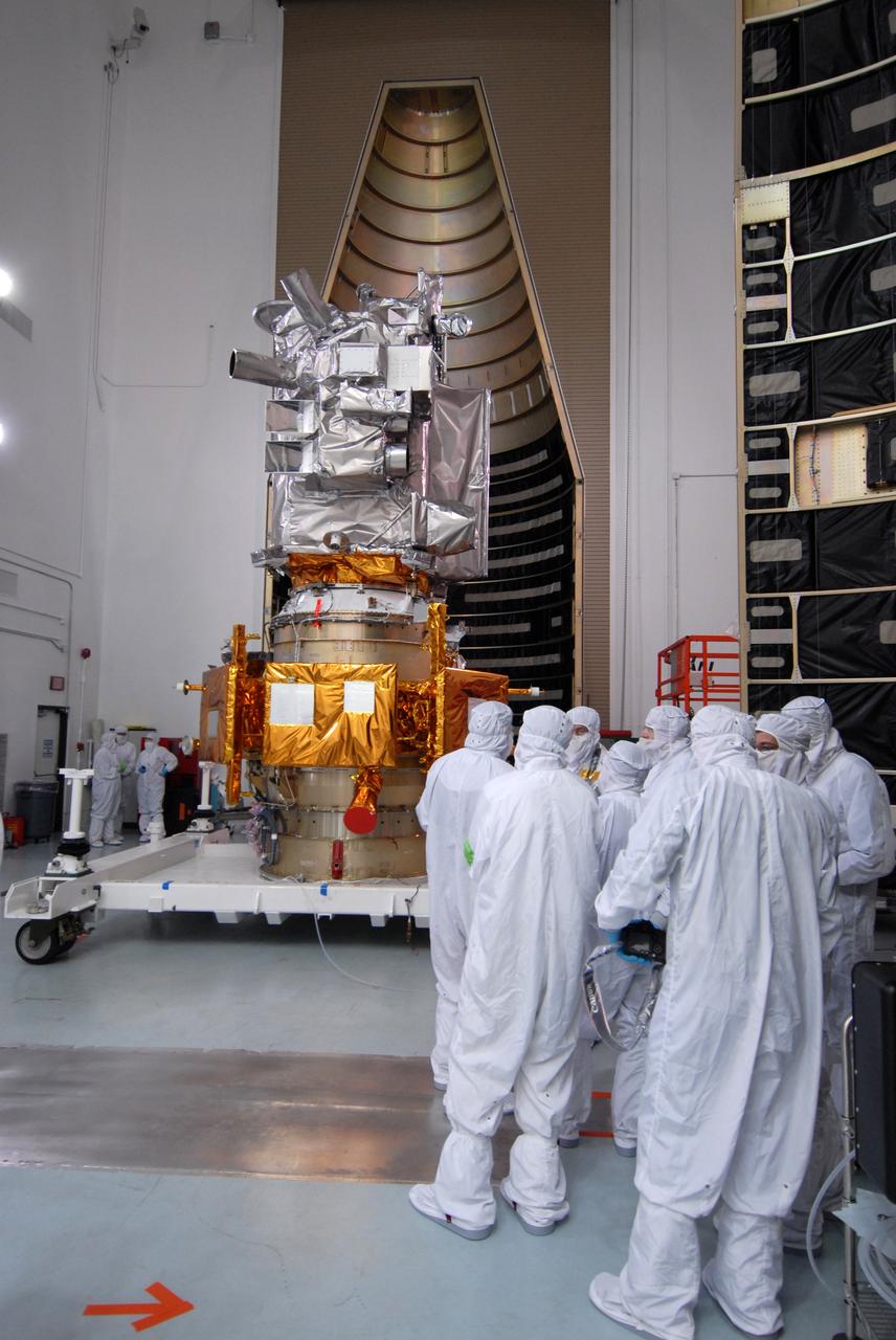 CAPE CANAVERAL, Fla. – At Astrotech Space Operations Facility in Titusville, Fla., garbed media representatives attend a showing of NASA's Lunar Reconnaissance Orbiter, or LRO, and NASA's Lunar Crater Observation and Sensing Satellite, known as LCROSS.  The LRO includes five instruments:  DIVINER, LAMP, LEND, LOLA and LROC.  They will be launched aboard an Atlas V/Centaur rocket no earlier than June 17 from Launch Complex-41 on Cape Canaveral Air Force Station in Florida.  Photo credit: NASA/Jack Pfaller