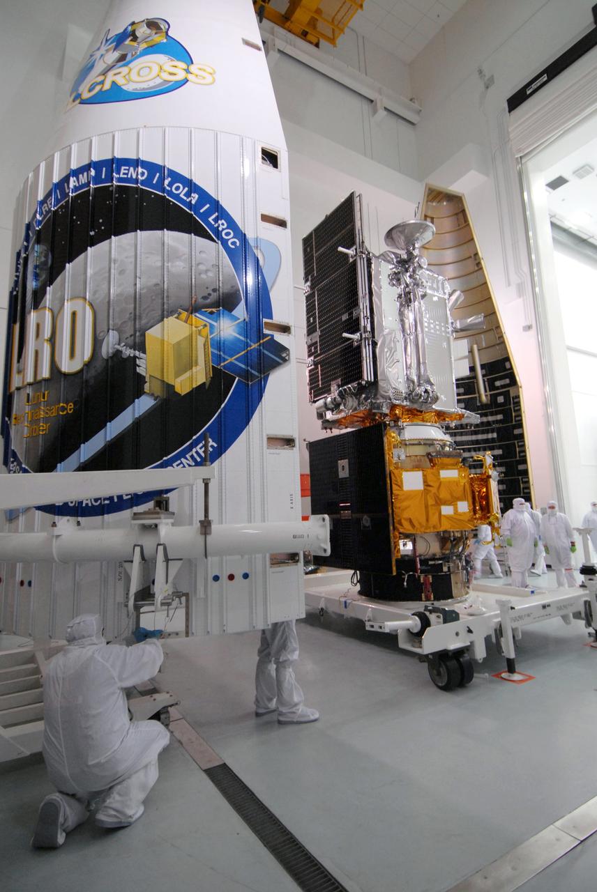CAPE CANAVERAL, Fla. – At Astrotech Space Operations Facility in Titusville, Fla., NASA's Lunar Reconnaissance Orbiter, or LRO, and NASA's Lunar Crater Observation and Sensing Satellite, known as LCROSS,wait for fairing installation.  The fairing halves are on left and right of the spacecraft. The fairing is a molded structure that fits flush with the outside surface of the rocket and forms an aerodynamically smooth nose cone, protecting the spacecraft during launch and ascent. The LRO includes five instruments:  DIVINER, LAMP, LEND, LOLA and LROC.  They will be launched aboard an Atlas V/Centaur rocket no earlier than June 17 from Launch Complex-41 on Cape Canaveral Air Force Station in Florida.  Photo credit: NASA/Jack Pfaller