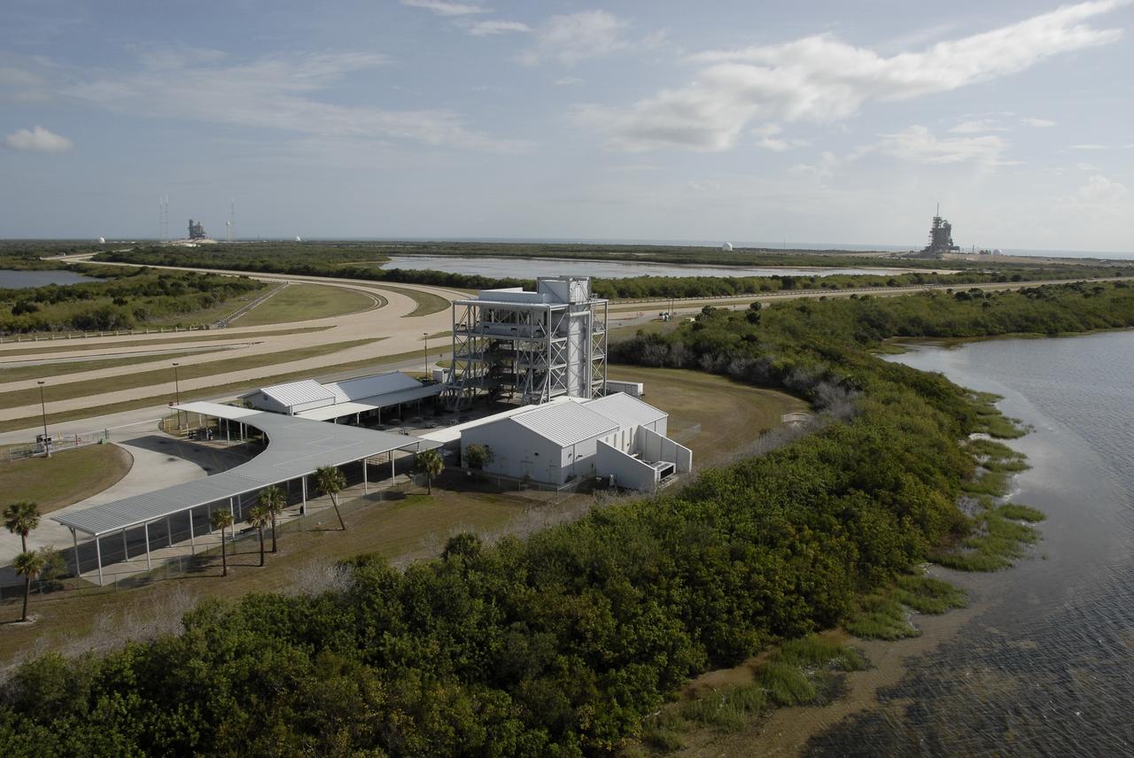 CAPE CANAVERAL, Fla. – This aerial view of NASA's Kennedy Space Center shows the observation gantry, which has a clear view of Launch Pad 39B (upper left) and Launch Pad 39A (upper right). Space shuttle Endeavour is on pad 39B, prepared for liftoff in the unlikely event that a rescue mission is necessary during space shuttle Atlantis' STS-125 mission to service NASA's Hubble Space Telescope. Photo credit: NASA/Kim Shiflett