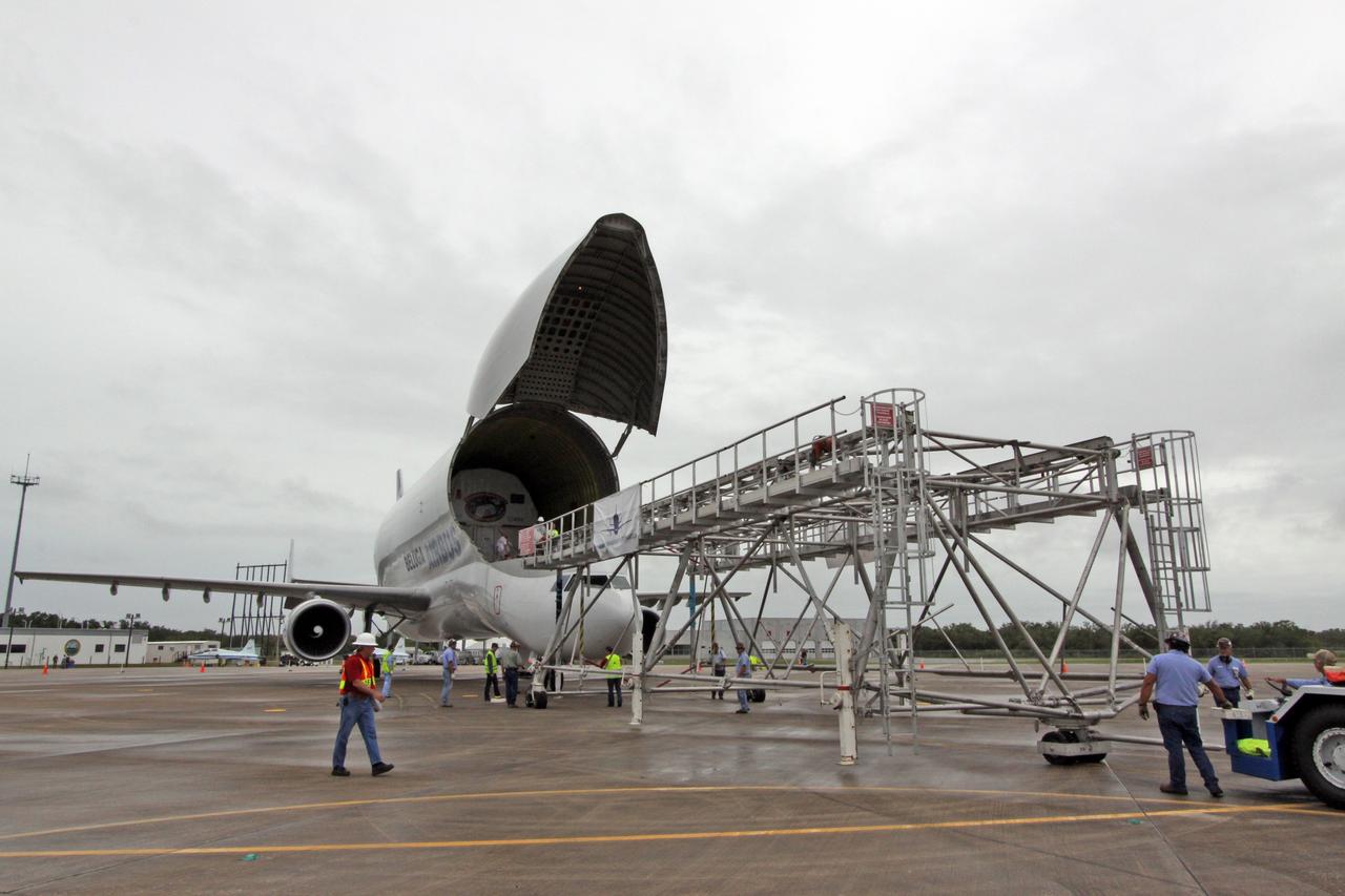CAPE CANAVERAL, Fla. – On the Shuttle Landing Facility at NASA's Kennedy Space Center in Florida, the offload equipment is moved close to the open nose of the Beluga Airbus.  Inside the airbus is the Node 3 module that will be delivered to the International Space Station on the STS-130 mission. Tranquility will eventually house the life support equipment necessary for the space station's permanent crew of six. It will also accommodate the European Space Agency's Cupola observation module, a seven-window, dome-shaped structure.  Tranquility is targeted for launch aboard space shuttle Endeavour in February 2010.  Photo credit: NASA/Jack Pfaller