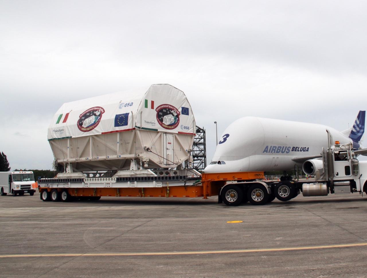 CAPE CANAVERAL, Fla. – On the Shuttle Landing Facility at NASA's Kennedy Space Center in Florida, the Node 3 module is secure on the flatbed for its trip to the Space Station Processing Facility. Named Tranquility, the module will be delivered to the International Space Station on the STS-130 mission. Tranquility will eventually house the life support equipment necessary for the space station's permanent crew of six. It will also accommodate the European Space Agency's Cupola observation module, a seven-window, dome-shaped structure. Tranquility is targeted for launch aboard space shuttle Endeavour in February 2010. Photo credit: NASA/Jack Pfaller