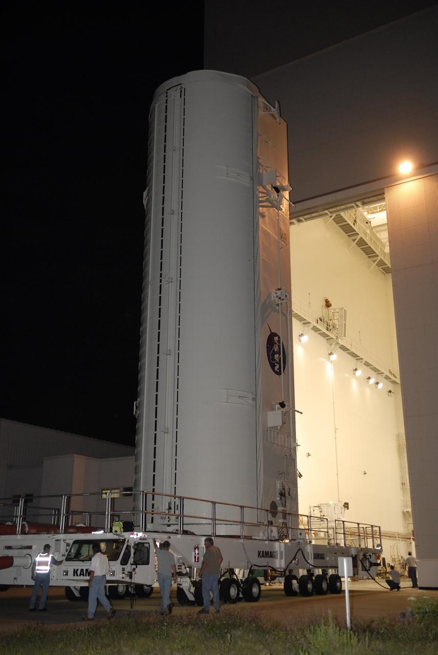 CAPE CANAVERAL, Fla. – The transporter with the payload canister exits the Canister Rotation Facility at NASA's Kennedy Space Center in Florida.  Inside the canister is space shuttle Endeavour's payload for the STS-127 mission, which includes the Japan Aerospace Exploration Agency's Kibo Exposed Facility and the Experiment Logistics Module Exposed Section to the International Space Station.  They will be installed on the Kibo laboratory on the station.  Launch of Endeavour is targeted for June 13.  Photo credit: NASA/Kim Shiflett