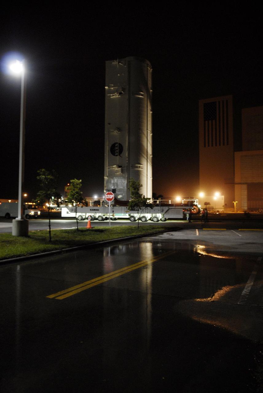 CAPE CANAVERAL, Fla. – The transporter with the payload canister rolls past the Vehicle Assembly Building at NASA's Kennedy Space Center in Florida on its way to Launch Pad 39A.  Inside the canister is space shuttle Endeavour's payload for the STS-127 mission, which includes the Japan Aerospace Exploration Agency's Kibo Exposed Facility and the Experiment Logistics Module Exposed Section to the International Space Station.  They will be installed on the Kibo laboratory on the station.  Launch of Endeavour is targeted for June 13.  Photo credit: NASA/Kim Shiflett