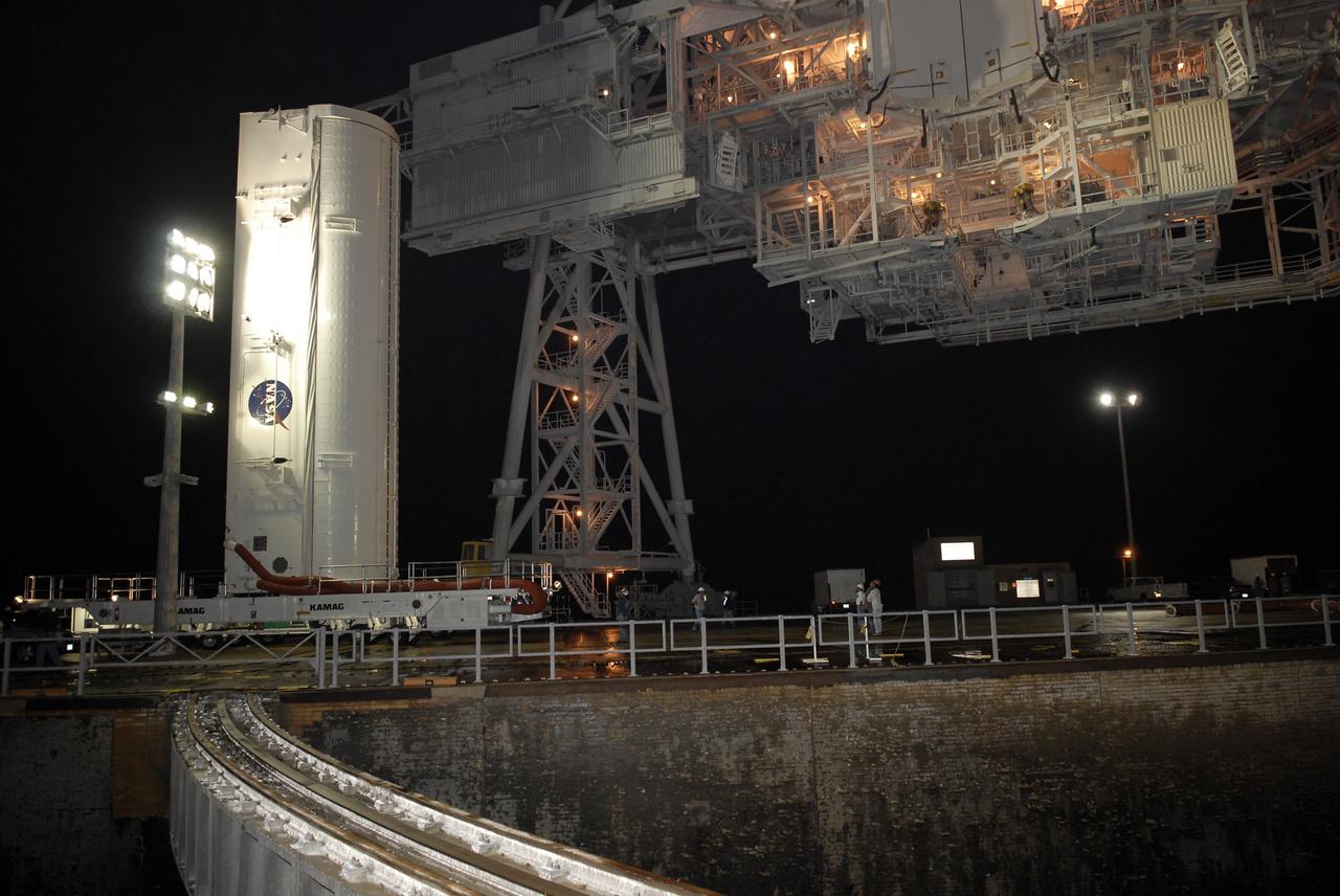 CAPE CANAVERAL, Fla. – – The transporter with the payload canister  nears on the rotating service structure, or RSS,  on Launch Pad 39A at NASA's Kennedy Space Center in Florida. When it is under the RSS, the canister will be lifted up into the Payload Changeout Room above.  Inside the canister is space shuttle Endeavour's payload for the STS-127 mission, which includes the Japan Aerospace Exploration Agency's Kibo Exposed Facility and the Experiment Logistics Module Exposed Section to the International Space Station.  They will be installed on the Kibo laboratory on the station.  Launch of Endeavour is targeted for June 13.  Photo credit: NASA/Kim Shiflett