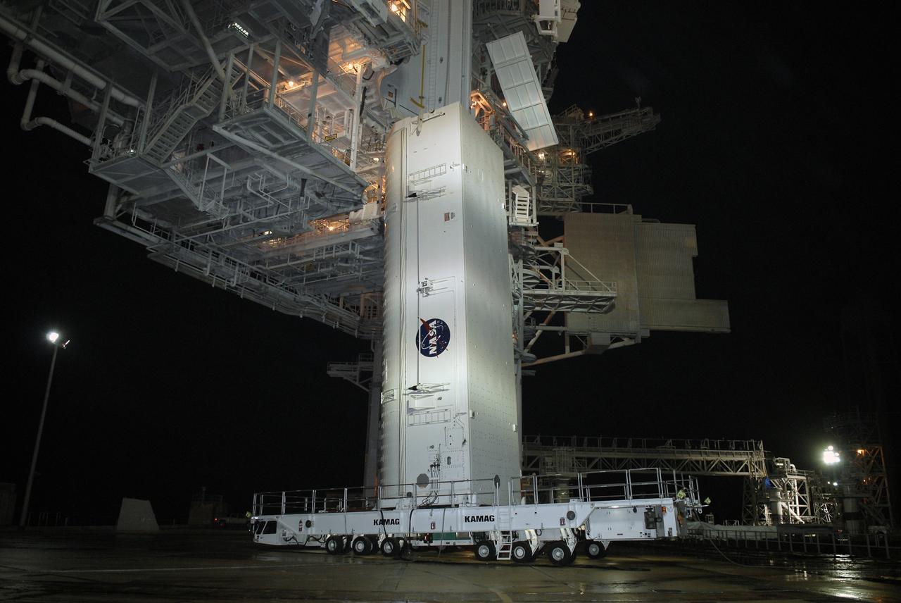 CAPE CANAVERAL, Fla. – – The transporter with the payload canister arrives under the rotating service structure, or RSS, on Launch Pad 39A at NASA's Kennedy Space Center in Florida. The canister will be lifted up into the Payload Changeout Room above. Inside the canister is space shuttle Endeavour's payload for the STS-127 mission, which includes the Japan Aerospace Exploration Agency's Kibo Exposed Facility and the Experiment Logistics Module Exposed Section to the International Space Station. They will be installed on the Kibo laboratory on the station. Launch of Endeavour is targeted for June 13. Photo credit: NASA/Kim Shiflett