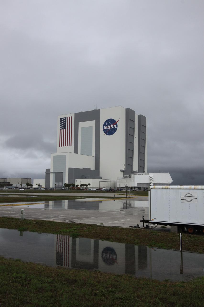 CAPE CANAVERAL, Fla. – Water saturates the ground and stands on the surface of a parking lot across the street from NASA Kennedy Space Center's Vehicle Assembly Building, the aftermath of thunderstorms in the vicinity of Kennedy’s Shuttle Landing Facility. Two landing opportunities for space shuttle Atlantis to conclude the STS-125 mission were waved off May 22 due to violations of the end-of-mission landing weather criteria. Through five spacewalks on the STS-125 mission, NASA's Hubble Space Telescope was refurbished and upgraded with state-of-the-art science instruments that will expand Hubble's capabilities and extend its operational lifespan through at least 2014. Photo credit: NASA/Jack Pfaller