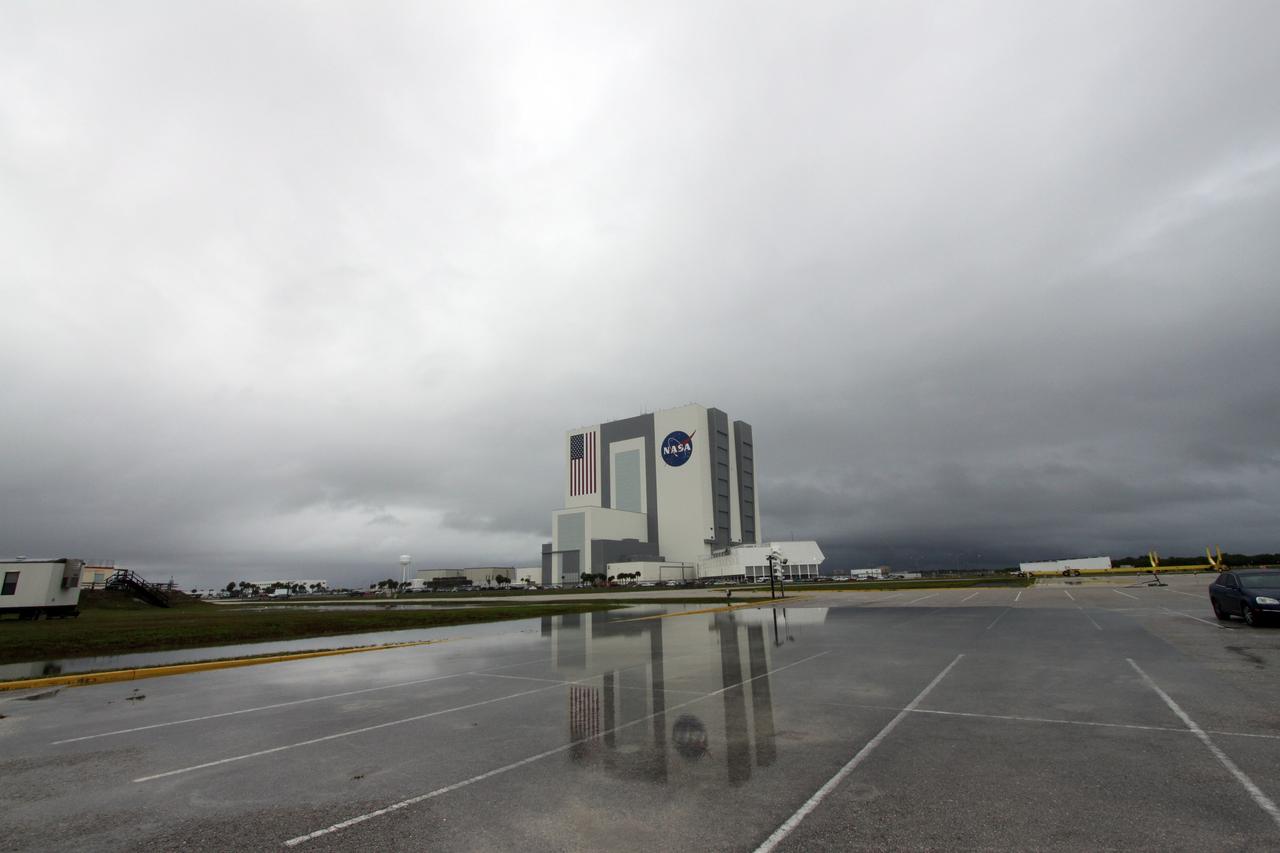 CAPE CANAVERAL, Fla. – Standing water collects on the surface of a parking lot across the street from NASA Kennedy Space Center's Vehicle Assembly Building, the aftermath of thunderstorms in the vicinity of Kennedy’s Shuttle Landing Facility. Two landing opportunities for space shuttle Atlantis to conclude the STS-125 mission were waved off May 22 due to violations of the end-of-mission landing weather criteria.  Through five spacewalks on the STS-125 mission, NASA's Hubble Space Telescope was refurbished and upgraded with state-of-the-art science instruments that will expand Hubble's capabilities and extend its operational lifespan through at least 2014.    Photo credit: NASA/Jack Pfaller