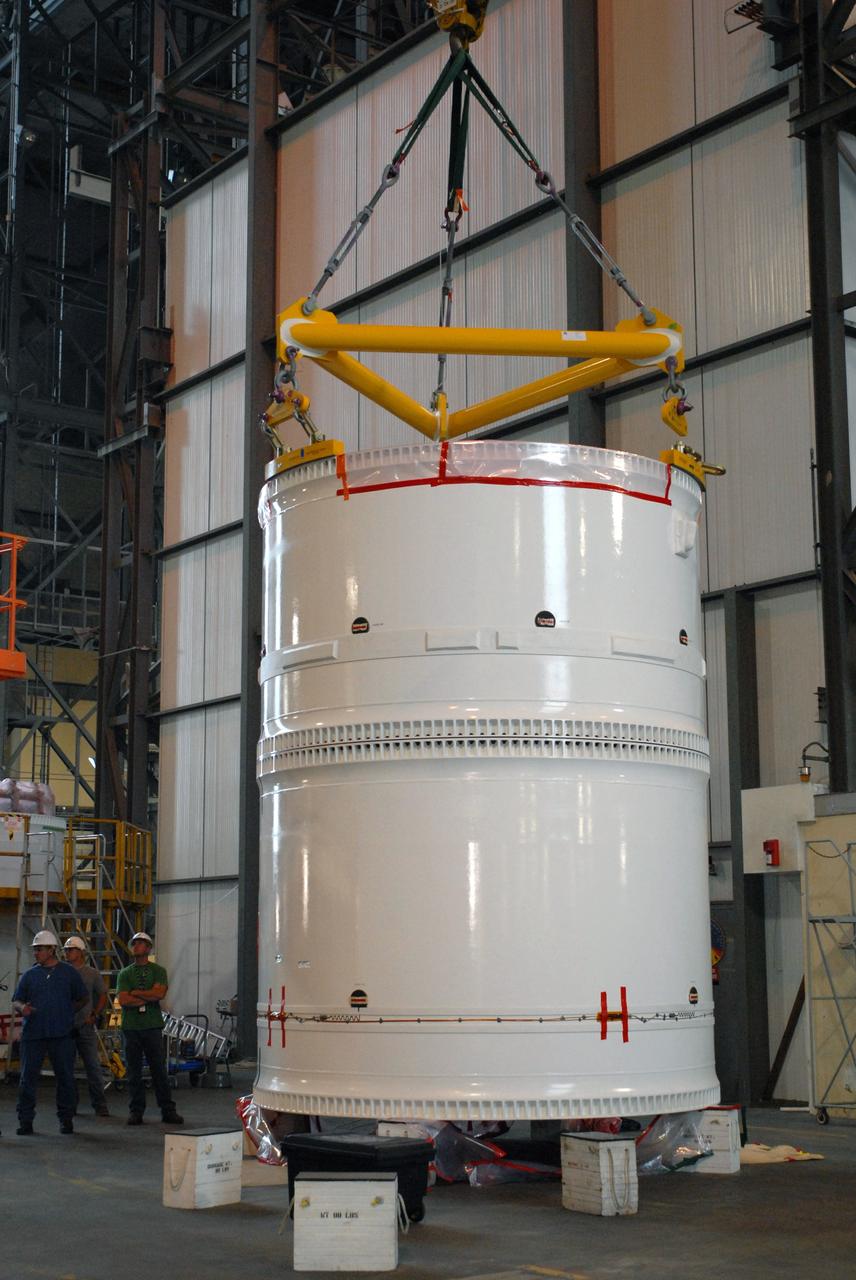 CAPE CANAVERAL, Fla. – In the transfer aisle of the Vehicle Assembly Building at NASA's Kennedy Space Center in Florida, the conjoined forward and center segments of the fifth segment simulator for the Ares I-X is attached to a crane prior to lifting operations.  The segments will be mated to the simulator’s aft segment. Ares I-X is the test vehicle for the Ares I, a component of the Constellation Program to return men to the moon and beyond. Ares I is the essential core of a safe, reliable, cost-effective space transportation system that eventually will carry crewed missions back to the moon, on to Mars and out into the solar system. The launch of the Ares I-X flight test is targeted for August 2009.  Photo credit: NASA/Jim Grossmann