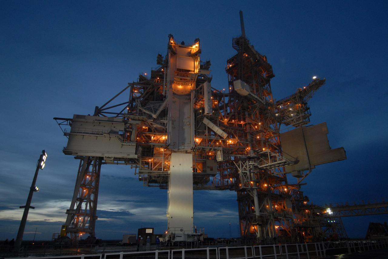 CAPE CANAVERAL, Fla. – At Launch Pad 39A at NASA's Kennedy Space Center in Florida, the canister containing the payload for space shuttle Endeavour’s STS-127 mission is prepared for its lift into the Payload Changeout Room above. Endeavour’s rollaround from Pad 39B to Pad 39A is planned for May 30. The STS-127 payload includes the Japan Aerospace Exploration Agency's Kibo Exposed Facility and the Experiment Logistics Module Exposed Section of the International Space Station. They will be installed on the Kibo laboratory already on the station. Launch of the STS-127 mission is targeted for June 13.  Photo credit: NASA/Tim Jacobs