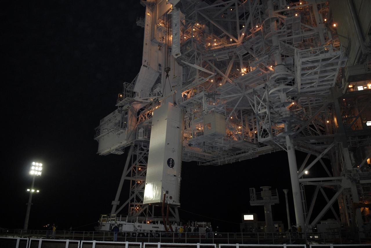 CAPE CANAVERAL, Fla. - At Launch Pad 39A at NASA's Kennedy Space Center in Florida, a crane lifts the canister containing the payload for space shuttle Endeavour’s STS-127 mission from its transporter toward the Payload Changeout Room. Endeavour’s rollaround from Pad 39B to Pad 39A is planned for May 30. The STS-127 payload includes the Japan Aerospace Exploration Agency's Kibo Exposed Facility and the Experiment Logistics Module Exposed Section of the International Space Station. They will be installed on the Kibo laboratory already on the station. Launch of the STS-127 mission is targeted for June 13.  Photo credit: NASA/Kim Shiflett