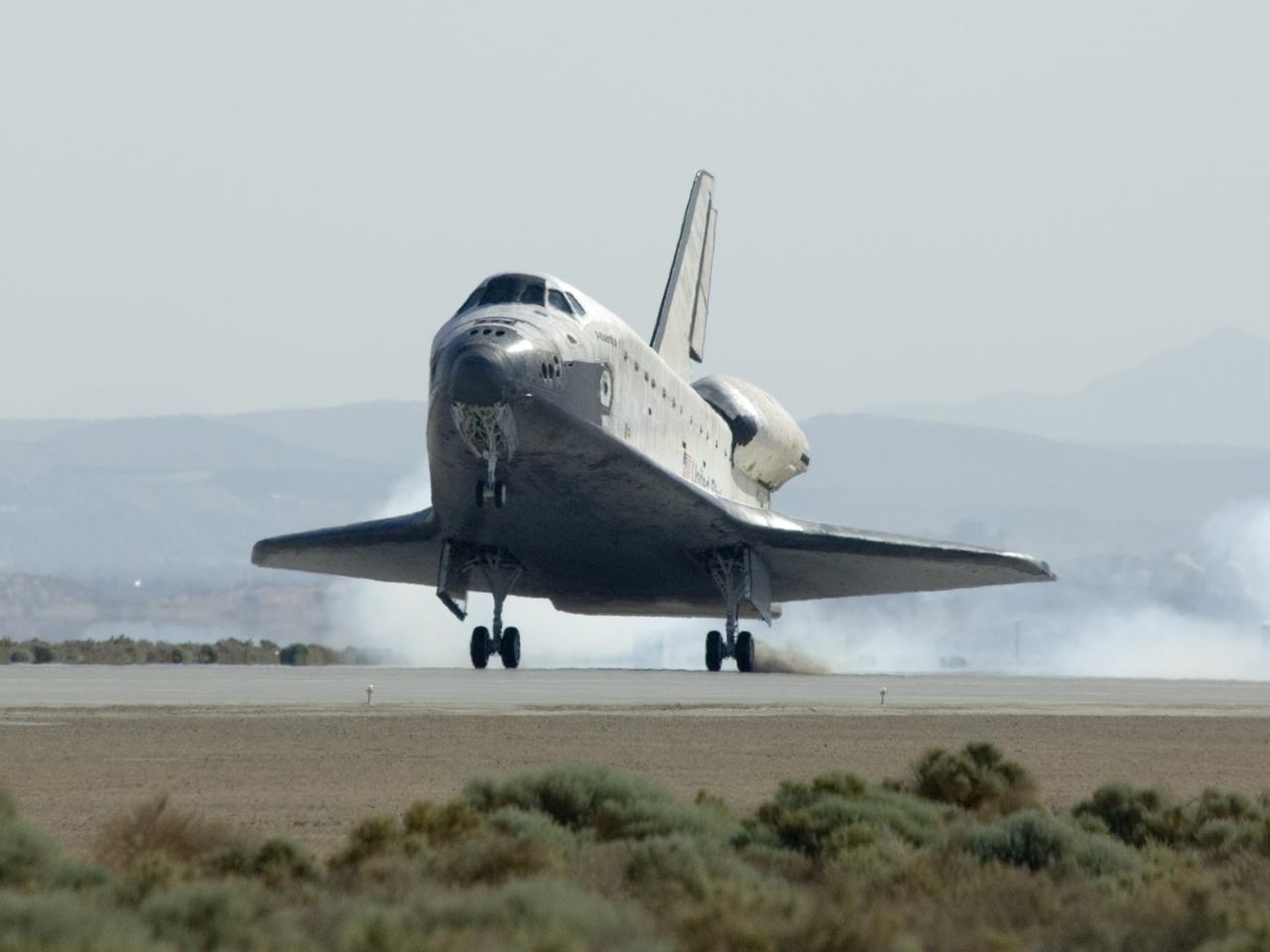 EDWARDS, Calif. - ED09-0127-01 - Space shuttle Atlantis touches down on Runway 22 at Edwards Air Force Base in California, ending a journey of 5.3 million miles on the STS-125 mission to repair and upgrade NASA’s Hubble Space Telescope.  Main gear touchdown was at 11:39:05 a.m. EDT.  Nose gear touchdown was at 11:39:15 a.m. EDT.  Wheel stop was at 11:40:15 a.m., bringing the mission’s elapsed time to 12 days, 21 hours, 37 minutes, 9 seconds.    Landing opportunities on May 22, May 23 and May 24 were waved off due to weather concerns at NASA’s Kennedy Space Center in Florida, the shuttle’s primary landing site. Through five spacewalks, NASA's Hubble Space Telescope was refurbished and upgraded with state-of-the-art science instruments that will expand Hubble's capabilities and extend its operational lifespan through at least 2014.  Photo credit: NASA/Carla Thomas, EAFB