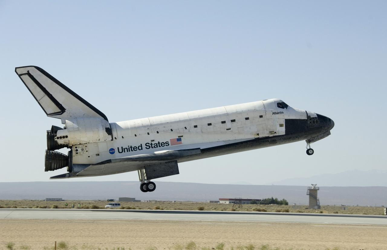 EDWARDS, Calif. - ED09-0127-03 - Space shuttle Atlantis and its seven-member crew near touchdown on Runway 22 at Edwards Air Force Base in California, ending a nearly 13-day journey of 5.3 million miles on the STS-125 mission to repair and upgrade NASA’s Hubble Space Telescope.  Main gear touchdown was at 11:39:05 a.m. EDT.  Nose gear touchdown was at 11:39:15 a.m. EDT.  Wheel stop was at 11:40:15 a.m., bringing the mission’s elapsed time to 12 days, 21 hours, 37 minutes, 9 seconds.  Landing opportunities on May 22, May 23 and May 24 were waved off due to weather concerns at NASA’s Kennedy Space Center in Florida, the shuttle’s primary landing site. Through five spacewalks, NASA's Hubble Space Telescope was refurbished and upgraded with state-of-the-art science instruments that will expand Hubble's capabilities and extend its operational lifespan through at least 2014.  Photo credit: NASA/Tony Landis, EAFB