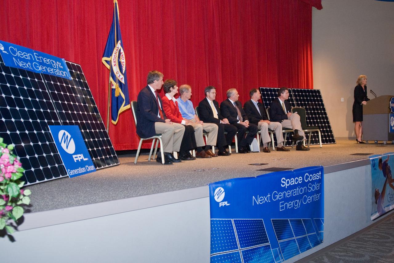CAPE CANAVERAL, Fla. – Pam Rauch, vice president of External Affairs for Florida Power & Light, or FPL, speaks to guests at the groundbreaking ceremony for the joint NASA and FPL solar power project at NASA's Kennedy Space Center. Others on the stage are Ed Smeloff with SunPower Corporation, Florida Rep. Suzanne Kosmas, Sen. Bill Nelson, Center Director Bob Cabana, Armando Olivera, president and CEO of FPL, Florida Rep. Bill Posey and Eric Draper, deputy director of Audubon of Florida. FPL, Florida's largest electric utility, will build and maintain two solar photovoltaic power generation systems at Kennedy. One will produce an estimated 10 megawatts of emissions-free power for FPL customers, which is enough energy to serve roughly 1,100 homes. The second is a one-megawatt solar power facility that will provide renewable energy directly to Kennedy. The FPL facilities at NASA will help provide Florida residents and America's space program with new sources of clean energy that will cut reliance on fossil fuels and improve the environment by reducing greenhouse gas emissions. The one megawatt facility also will help NASA meet its goal for use of power generated from renewable energy. Photo credit: NASA/Kim Shiflett