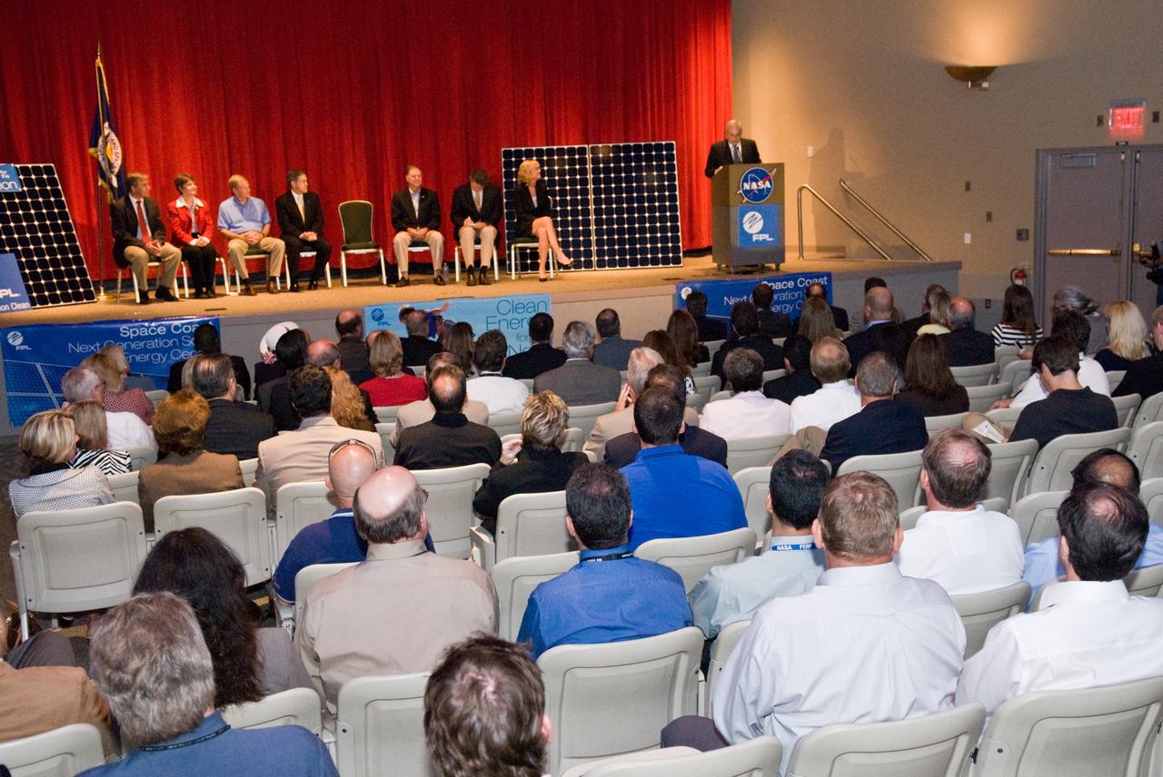 CAPE CANAVERAL, Fla. – Armando Olivera, president and CEO of Florida Power & Light, or FPL, speaks to guests at the groundbreaking ceremony for the joint NASA and FPL solar power project at NASA's Kennedy Space Center. Others on the stage are, from left, Ed Smeloff with SunPower Corporation, Florida Rep. Suzanne Kosmas, Sen. Bill Nelson, Center Director Bob Cabana, Florida Rep. Bill Posey, Eric Draper, deputy director of Audubon of Florida, and Pam Rauch, vice president of External Affairs for FPL. FPL, Florida's largest electric utility, will build and maintain two solar photovoltaic power generation systems at Kennedy. One will produce an estimated 10 megawatts of emissions-free power for FPL customers, which is enough energy to serve roughly 1,100 homes. The second is a one-megawatt solar power facility that will provide renewable energy directly to Kennedy. The FPL facilities at NASA will help provide Florida residents and America's space program with new sources of clean energy that will cut reliance on fossil fuels and improve the environment by reducing greenhouse gas emissions. The one megawatt facility also will help NASA meet its goal for use of power generated from renewable energy. Photo credit: NASA/Kim Shiflett