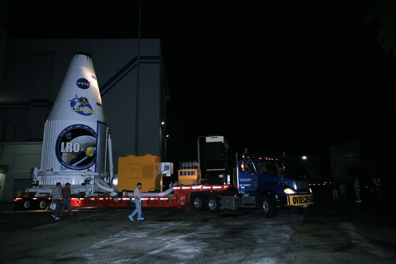 CAPE CANAVERAL, Fla. – Encased in the fairing, the Lunar Reconnaissance Orbiter, or LRO, and NASA's Lunar Crater Observation and Sensing Satellite, known as LCROSS, are moved out of Astrotech Space Operations in Titusville.  It is being transported to Launch Complex 41 at Cape Canaveral Air Force Station in Florida.  The LRO includes five instruments that will help NASA characterize the moon's surface:  DIVINER, LAMP, LEND, LOLA and LROC.  Along with LCROSS, they will be launched aboard an Atlas V/Centaur rocket on June 17. Photo credit: NASA/Dimitri Gerondidakis