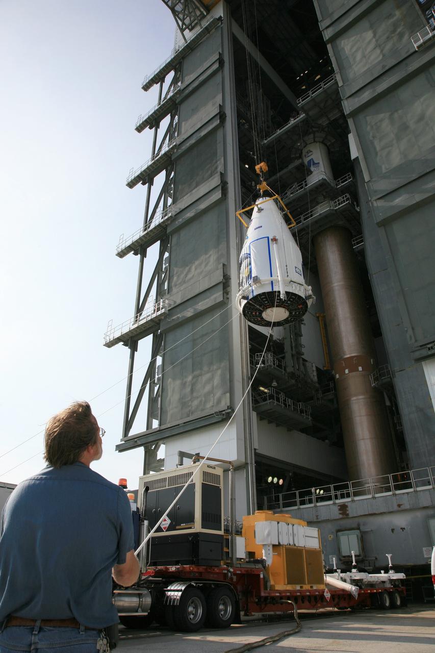 CAPE CANAVERAL, Fla. – On Launch Complex 41 at Cape Canaveral Air Force Station in Florida, the Lunar Reconnaissance Orbiter, or LRO, and NASA's Lunar Crater Observation and Sensing Satellite, known as LCROSS,  are lifted into the mobile service tower.  The LRO/LCROSS will be mated to the Atlas V rocket for launch. The LRO includes five instruments that will help NASA characterize the moon's surface:  DIVINER, LAMP, LEND, LOLA and LROC.  Along with LCROSS, they will be launched aboard an Atlas V/Centaur rocket on June 17. Photo credit: NASA/Dimitri Gerondidakis