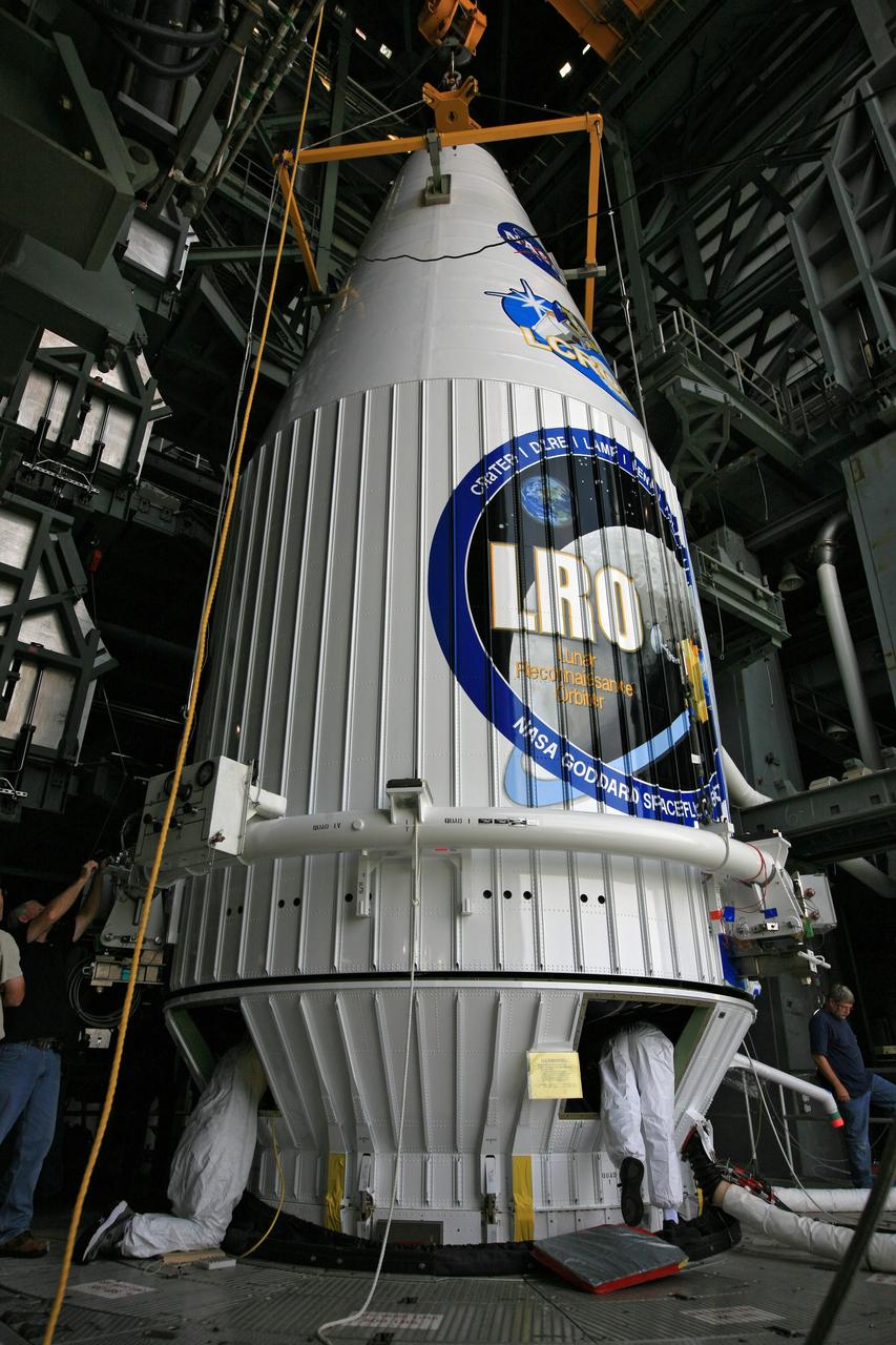 CAPE CANAVERAL, Fla. – On Launch Complex 41 at Cape Canaveral Air Force Station in Florida, workers prepare the Lunar Reconnaissance Orbiter, or LRO, and NASA's Lunar Crater Observation and Sensing Satellite, known as LCROSS, for mating inside the mobile service tower with the Atlas V rocket for launch. The LRO includes five instruments that will help NASA characterize the moon's surface:  DIVINER, LAMP, LEND, LOLA and LROC.  Along with LCROSS, they will be launched aboard an Atlas V/Centaur rocket on June 17. Photo credit: NASA/Dimitri Gerondidakis