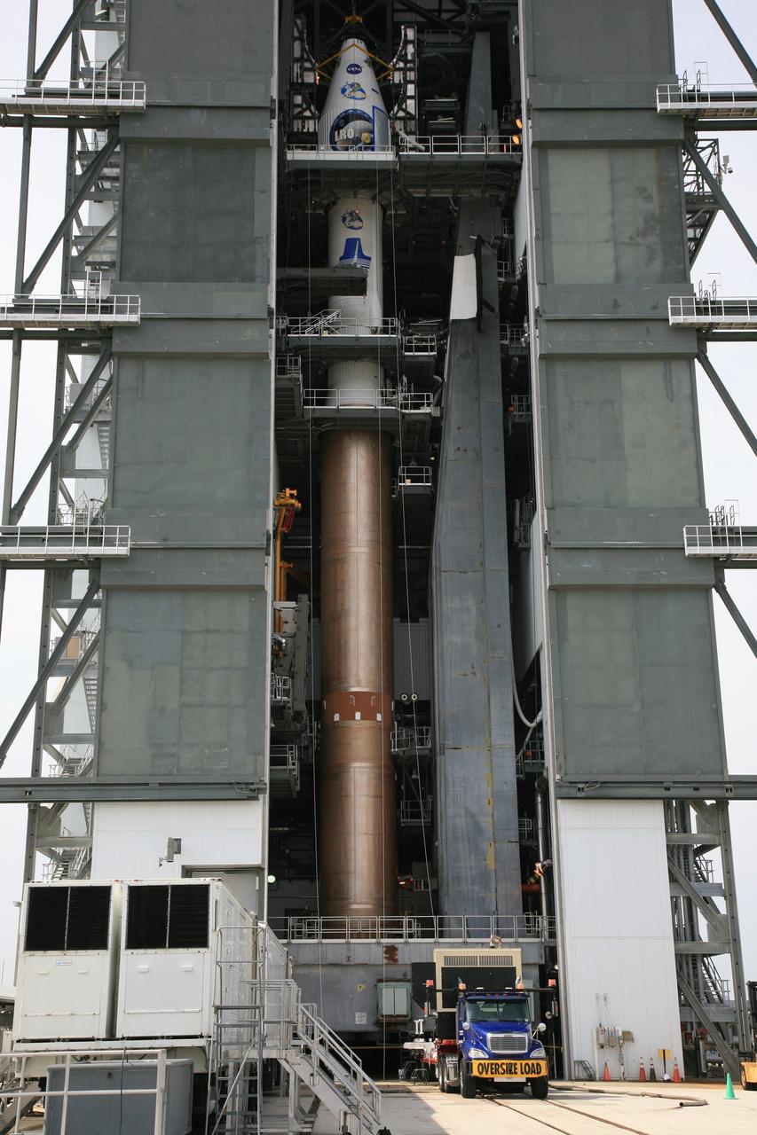 CAPE CANAVERAL, Fla. – On Launch Complex 41 at Cape Canaveral Air Force Station in Florida, the Lunar Reconnaissance Orbiter, or LRO, and NASA's Lunar Crater Observation and Sensing Satellite, known as LCROSS, are mated with the Atlas V rocket inside the mobile service tower for launch. The LRO includes five instruments that will help NASA characterize the moon's surface:  DIVINER, LAMP, LEND, LOLA and LROC.  Along with LCROSS, they will be launched aboard an Atlas V/Centaur rocket on June 17. Photo credit: NASA/Dimitri Gerondidakis