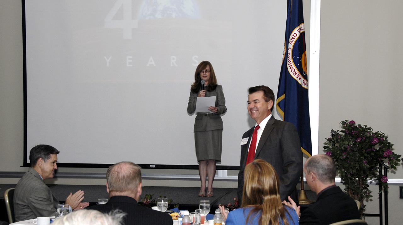CAPE CANAVERAL, Fla. – NASA Kennedy Space Center's External Relations Director Lisa Malone introduces Florida Senator Thad Altman during the annual Community Leaders Breakfast held in the Debus Center at Kennedy Space Center's Visitor Complex.  Seated at far left is Center Director Bob Cabana.  Community leaders, business executives, educators, community organizers and state and local government representatives heard Cabana provide an overview of operations at the space center and a look ahead at upcoming missions and activities. Photo credit: NASA/Kim Shiflett