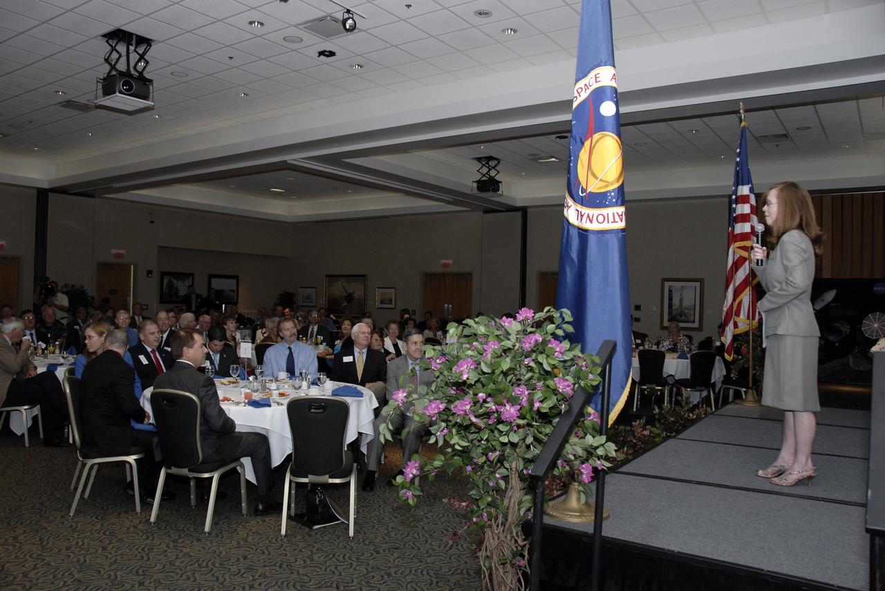 CAPE CANAVERAL, Fla. – NASA Kennedy Space Center's External Relations Director Lisa Malone hosts the annual Community Leaders Breakfast held in the Debus Center at Kennedy Space Center's Visitor Complex. On the right at the table at left are Florida Rep. Ralph Poppell and Center Director Bob Cabana.  Community leaders, business executives, educators, community organizers and state and local government heard Cabana provide an overview of operations at the space center and a look ahead at upcoming missions and activities. Photo credit: NASA/Kim Shiflett