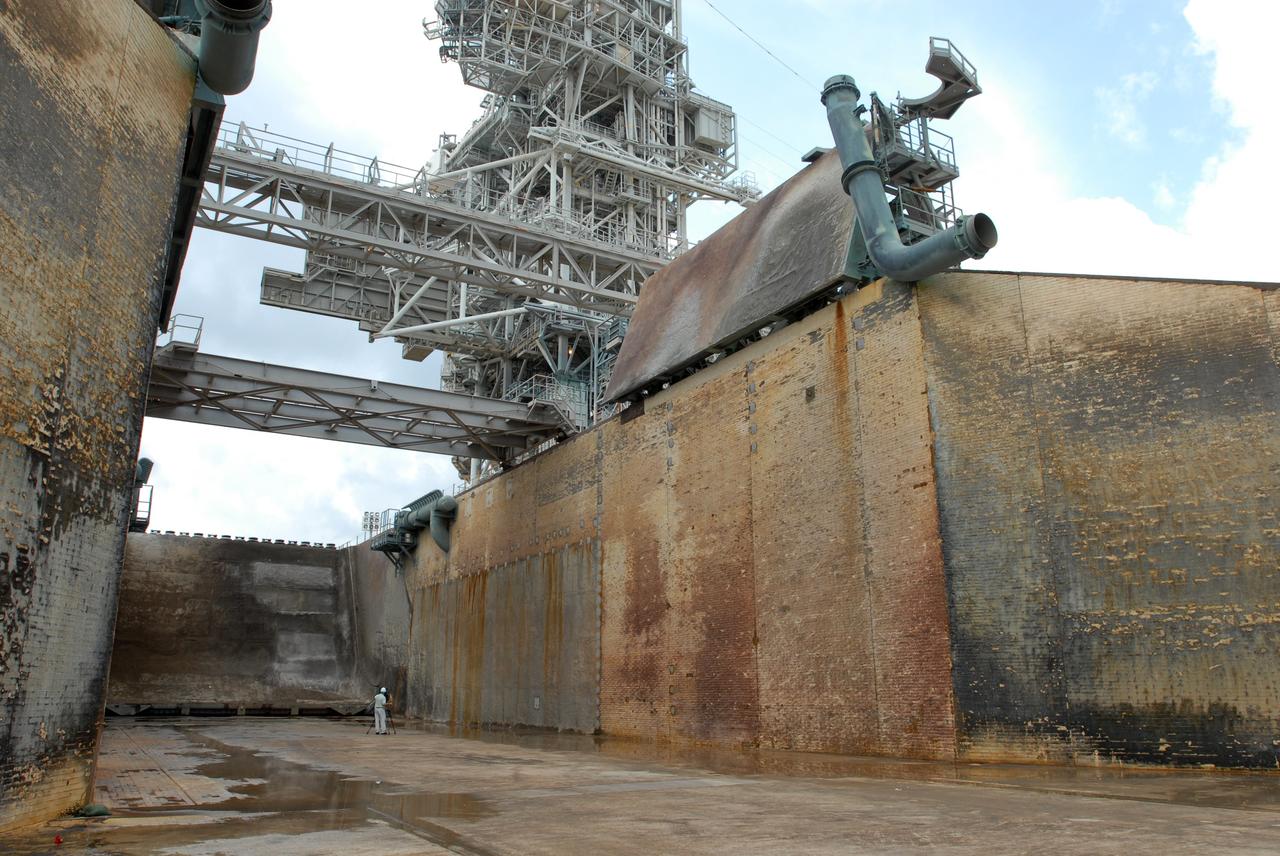 CAPE CANAVERAL, Fla. – A view of the flame trench on Launch Pad 39A at NASA's Kennedy Space Center in Florida where repairs of the Fondue Fyre have been made. After launch of space shuttle Atlantis on the STS-125 mission on May 11, a 25-square-foot area of Fondue Fyre from the north side of the solid rocket booster flame deflector was damaged. Some pneumatic lines (gaseous nitrogen, pressurized air) in the area also were damaged and needed to be repaired. The flame trench channels the flames and smoke exhaust of the shuttle's solid rocket boosters away from the space shuttle during liftoff. Fondue Fyre is a fire-resistant concrete-like material that replaced the original flame trench bricks. It can be sprayed on the surface. Pad 39A will be used for the launch of space shuttle Endeavour on the STS-127 mission targeted for June 13.  Photo credit: NASA/Jim Grossmann
